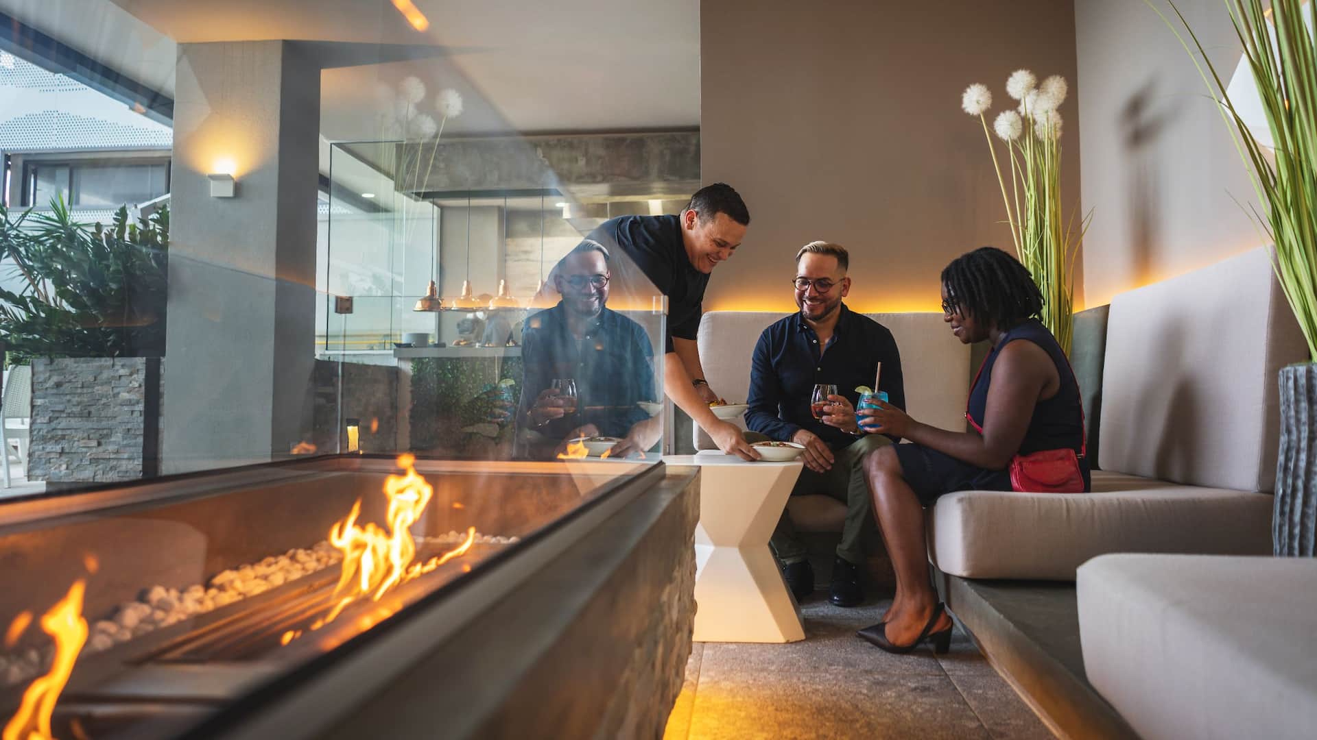 Hyatt Place Aruba Airport Lounge Firepit Couple Cocktails