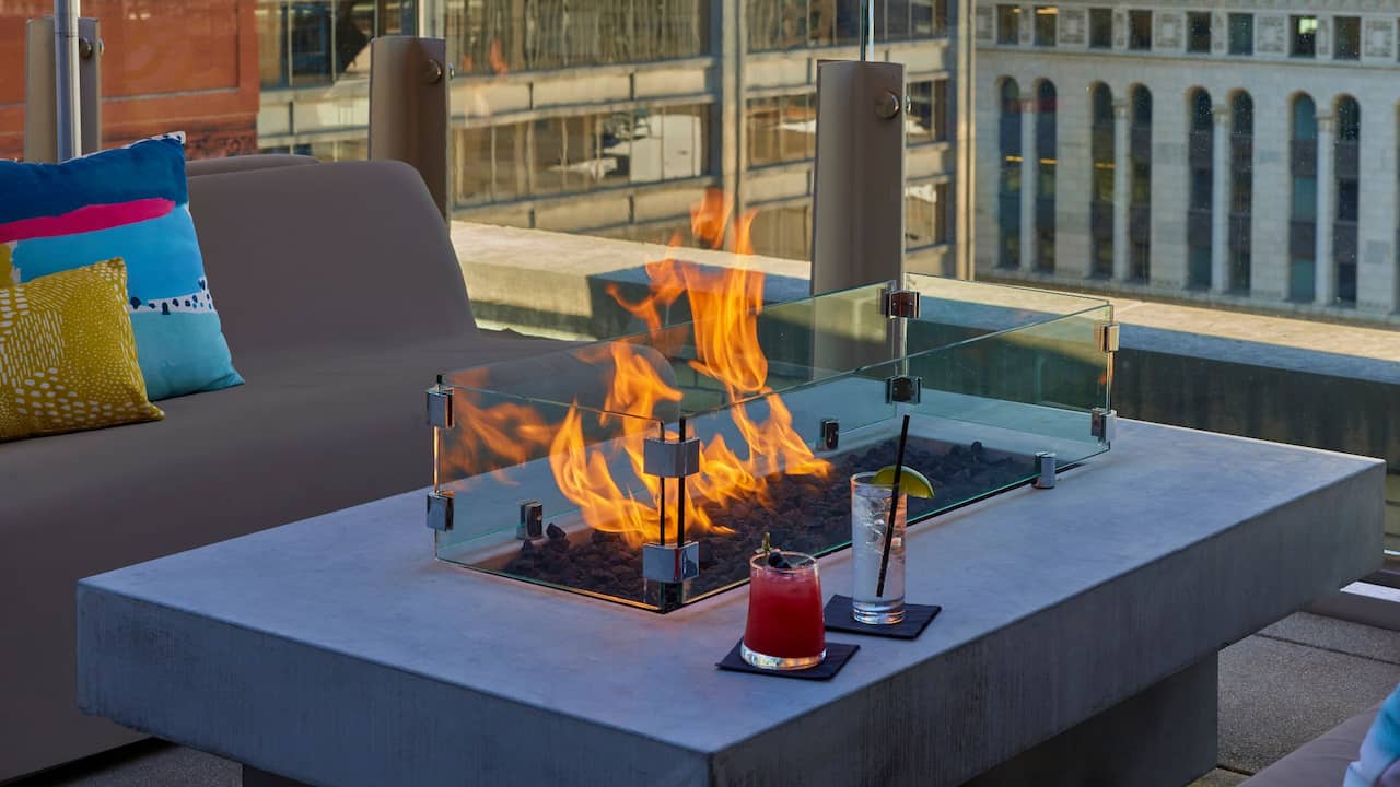 Fireside drinks at Aire Rooftop Bar