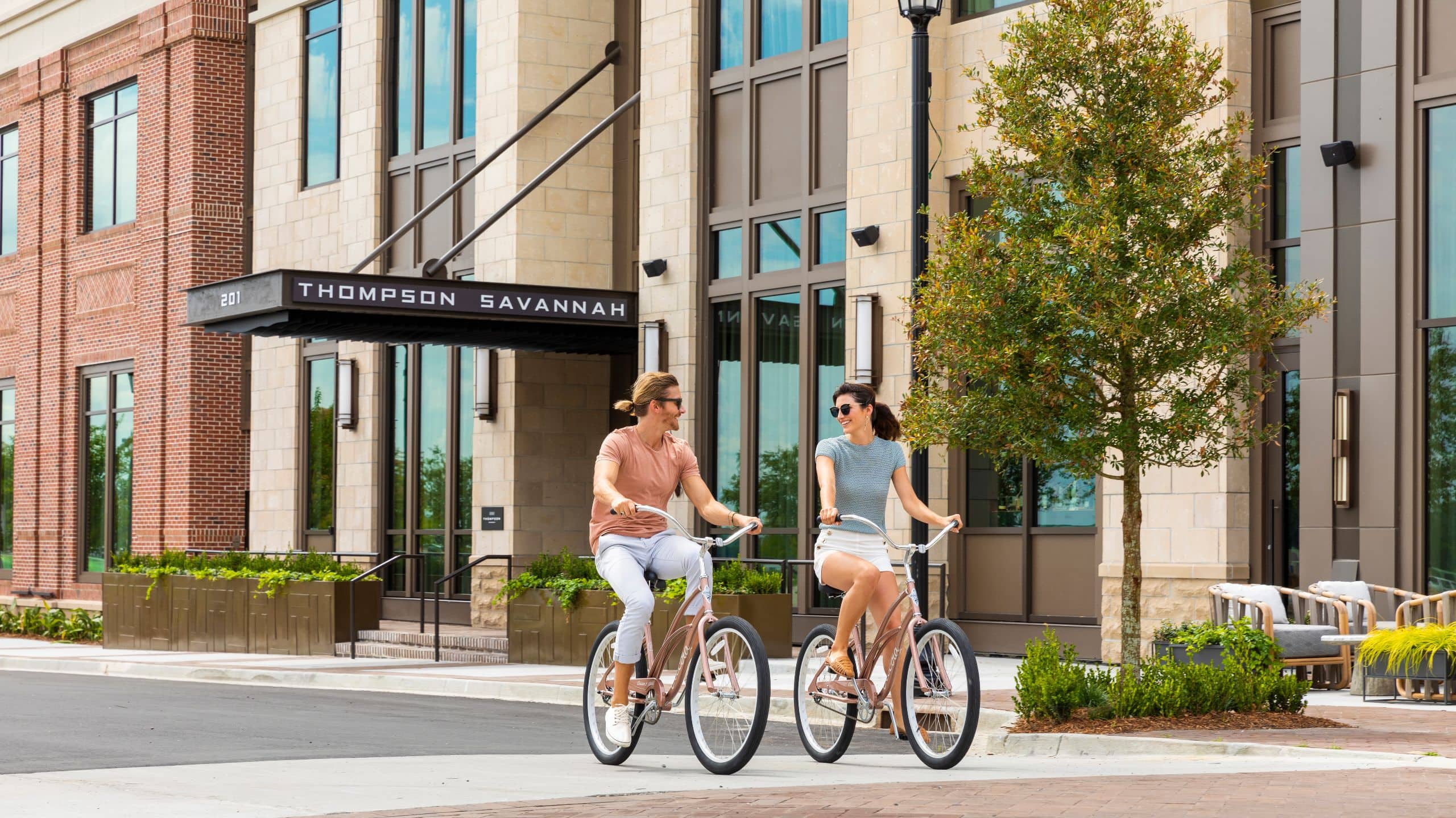 Thompson Savannah Exterior Bike Riding Couple