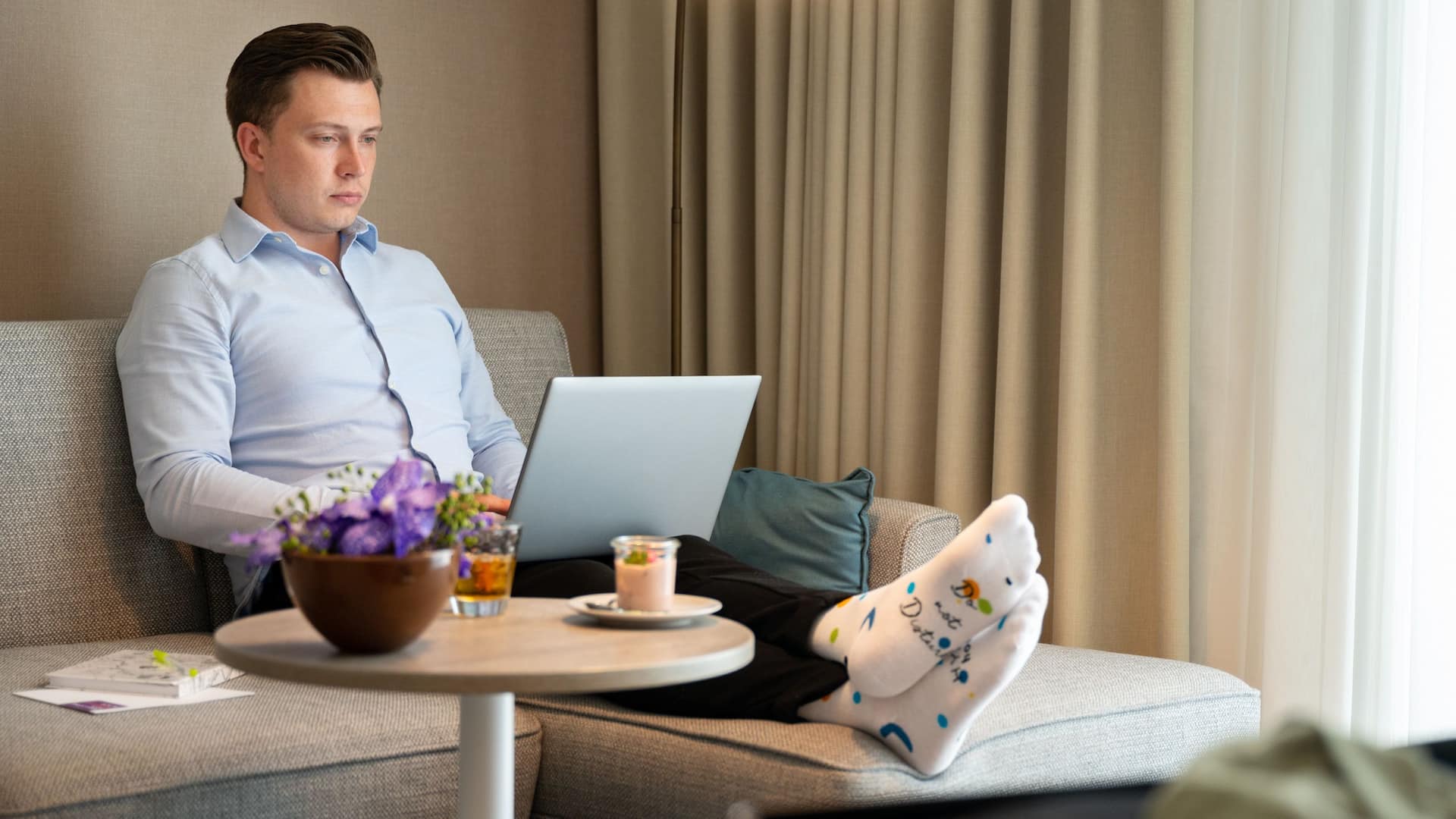 Hyatt Place Frankfurt Airport Businessman On Guestroom Couch