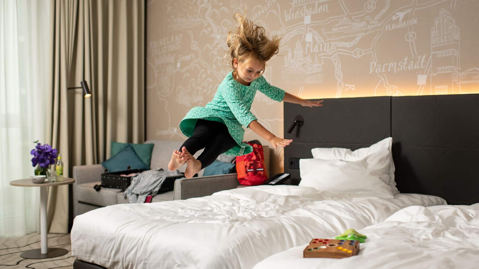 Hyatt Place Frankfurt Airport Girl Jumping On The Bed