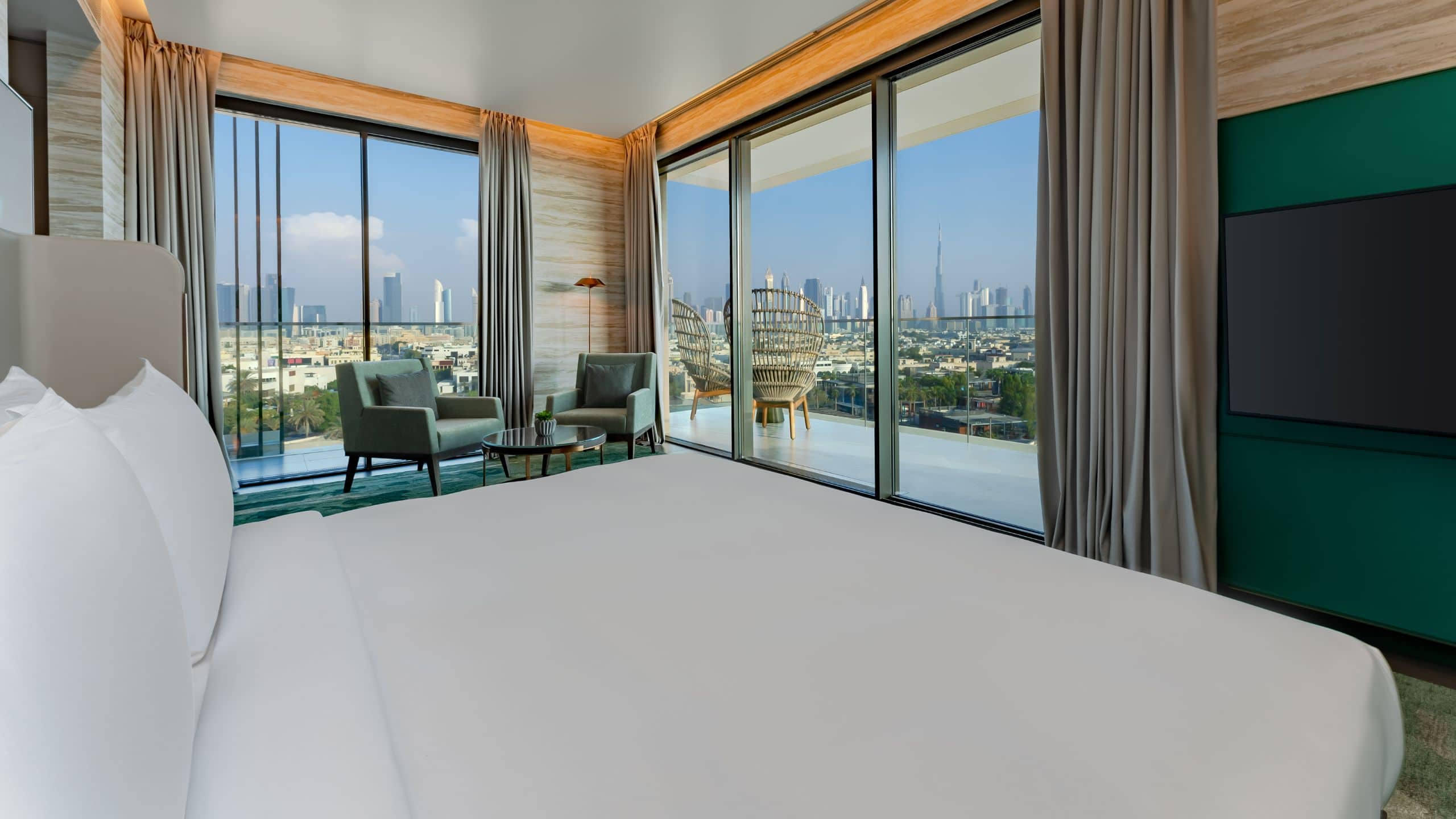 1 of 7 Hyatt Centric Jumeirah Dubai Executive Hotel Suite Bedroom offering views of Dubai skyline and the Arabian Gulf