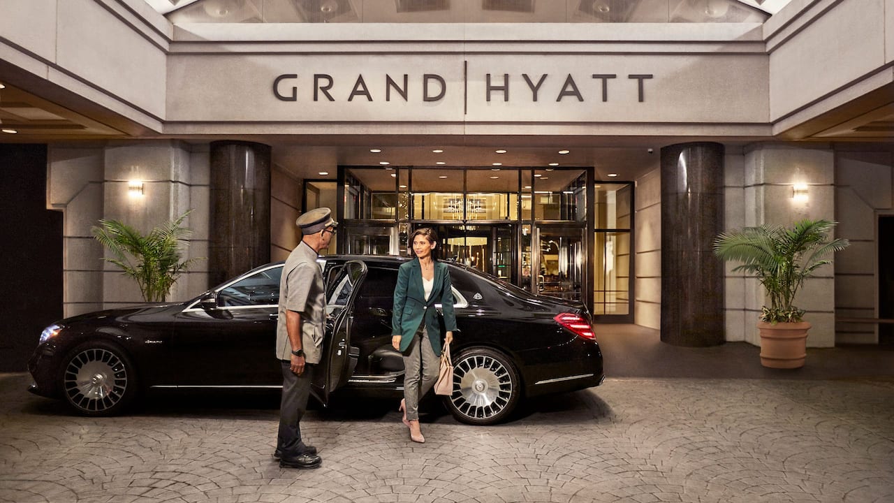 Doorman welcoming guests at hotel entrance at Grand Hyatt Washington