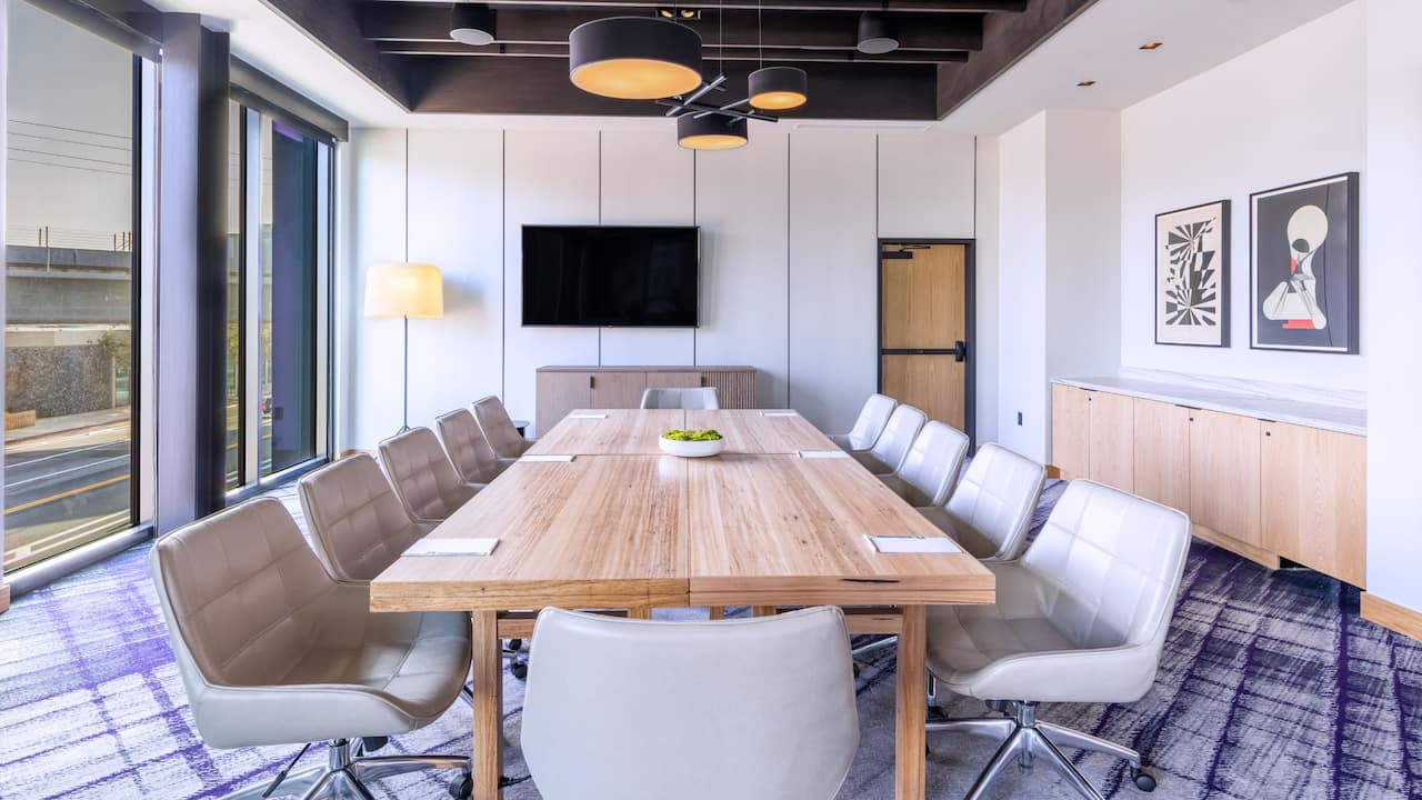 Helms meeting room with wooden conference table and leather office chairs