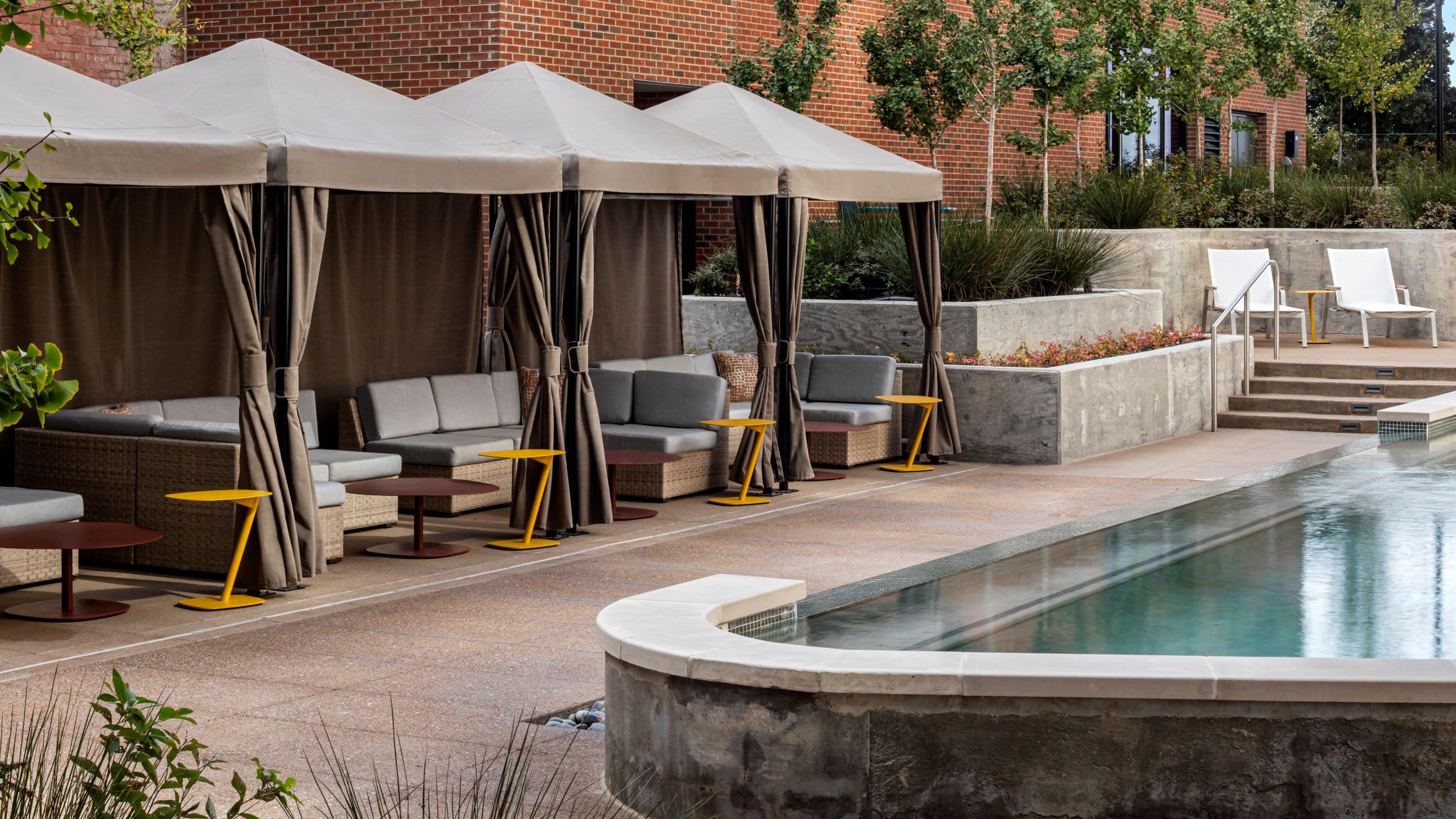Outdoor Pool Cabanas with lounge chairs