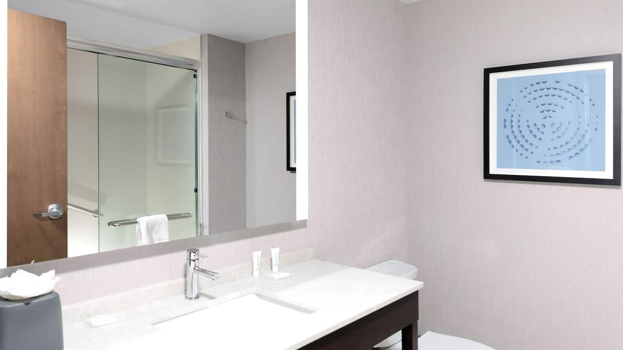 Bathroom with shower at Hyatt Place Charlotte / University Research Park near iFLY.