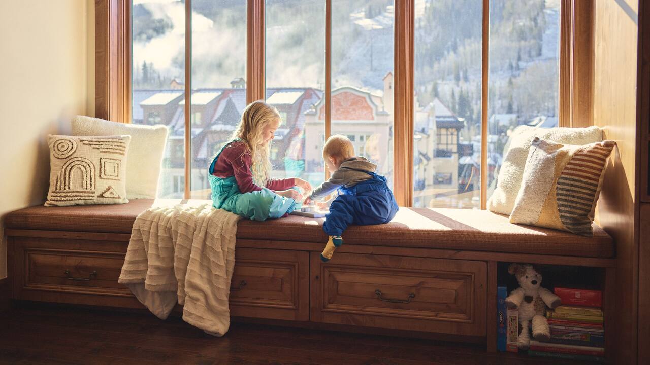 Kids Seated By Window