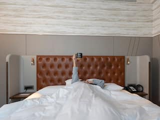 Hyatt Centric Jumeirah Dubai Guest Holding Mug In Bed