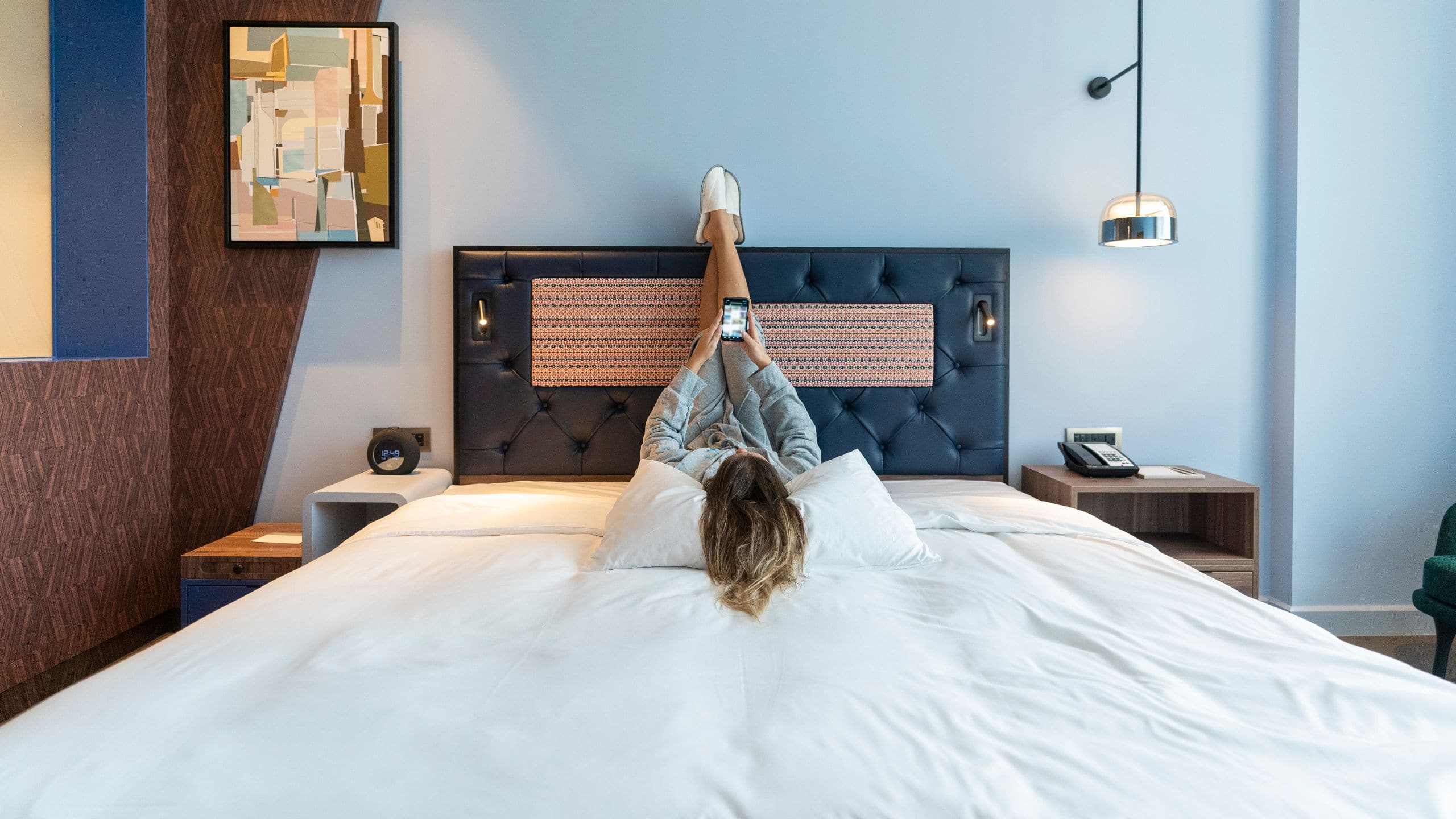 Hyatt Centric Jumeirah Dubai Guest In Bed With Mobile Phone
