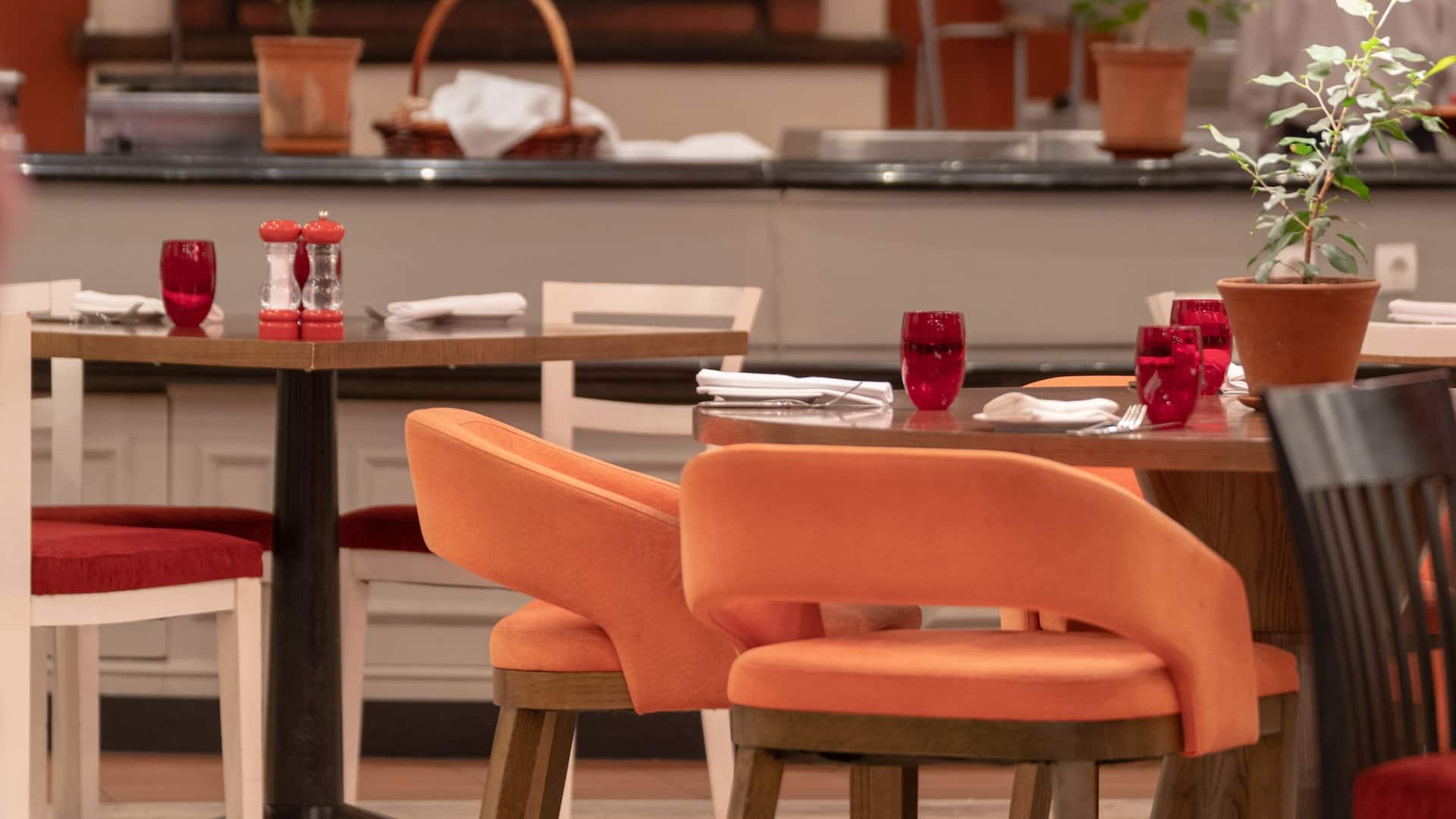 Tables and Chairs in Crostini Restaurant at the Hotel, Set for Dining