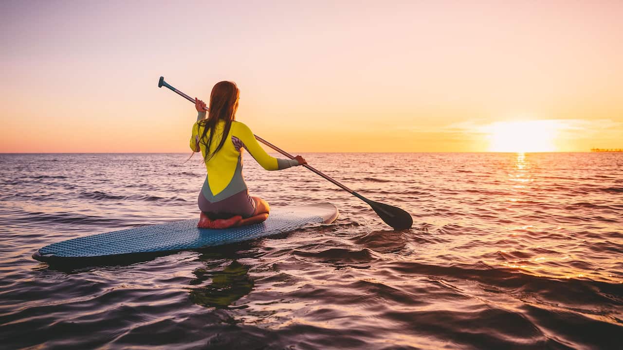 Woman Paddle Board Sunset View