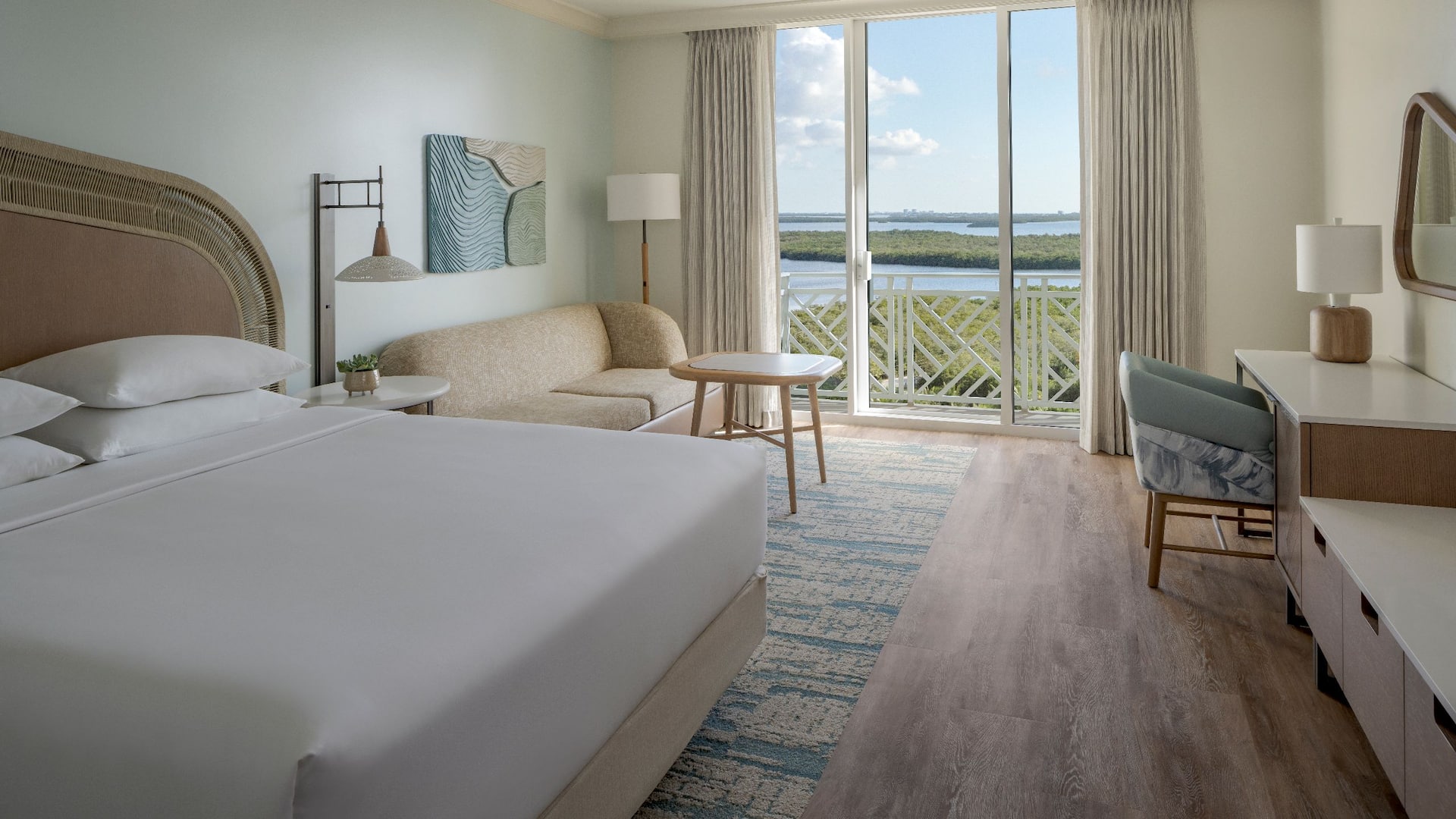 Hyatt Regency Coconut Point Resort and Spa King Bay View Suite Bed Desk Seating Area