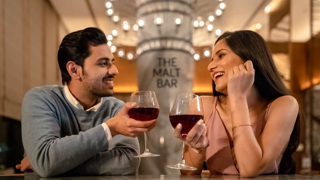 Couple Enjoying Malt Bar Drinks