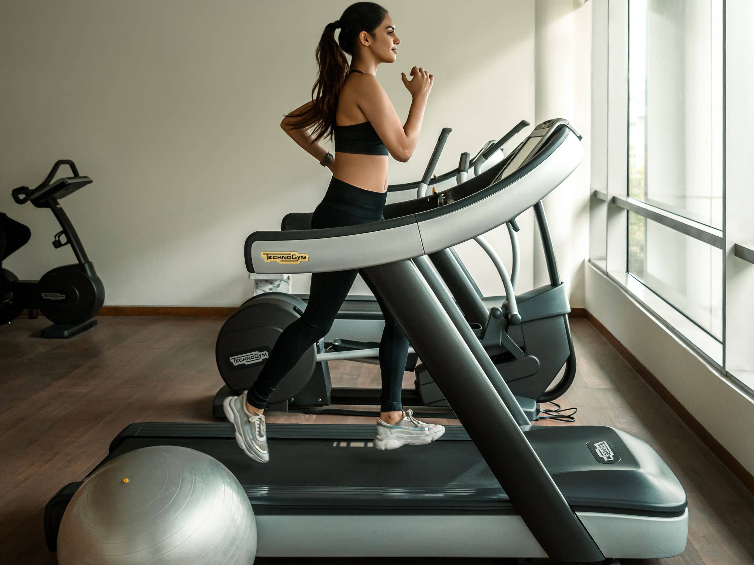Andaz Delhi Woman Running On Treadmill