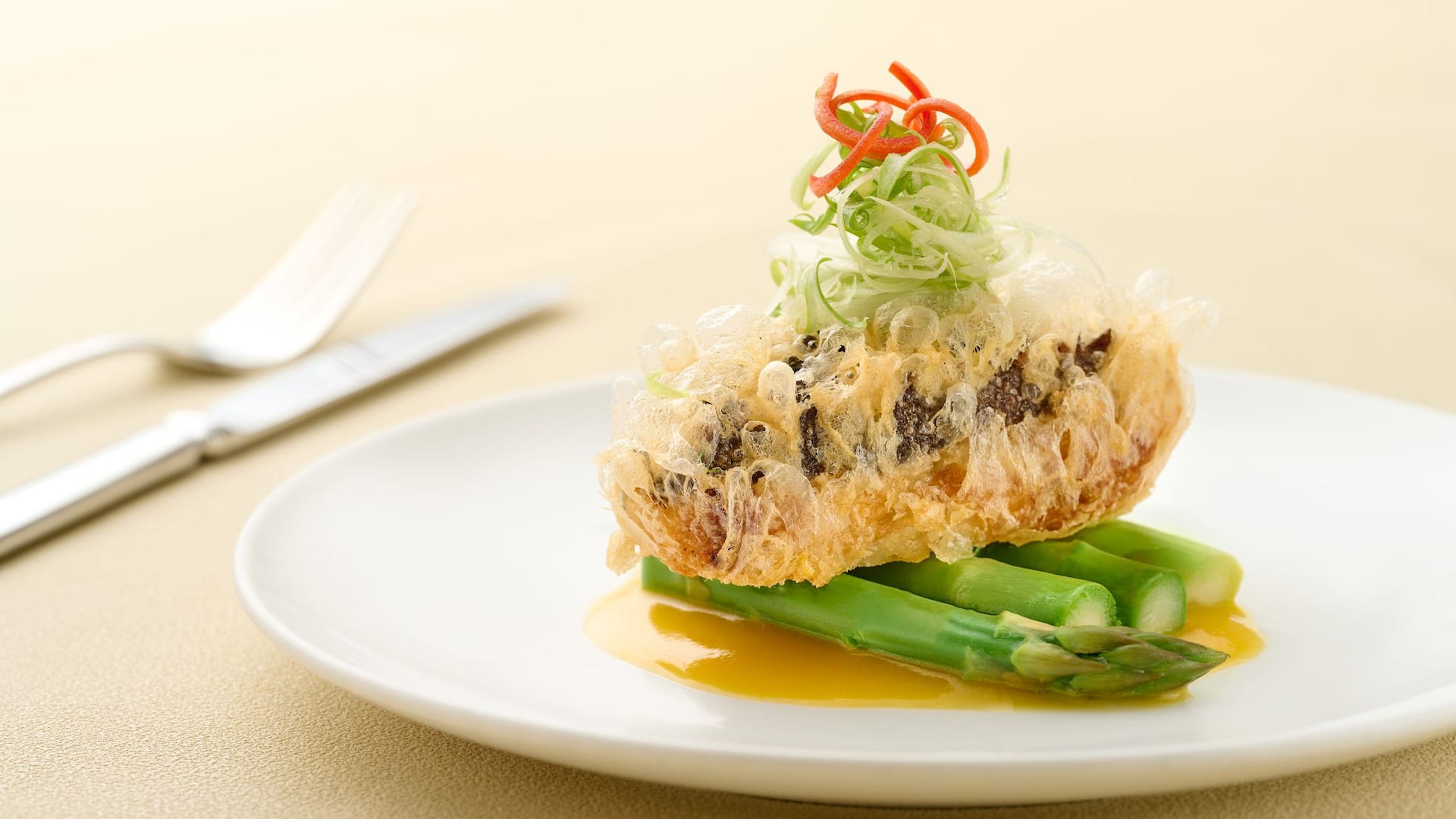 Braised Kanto Sea Cucumber stuffed with shrimp roe bean curd sheet roll, yellow broth