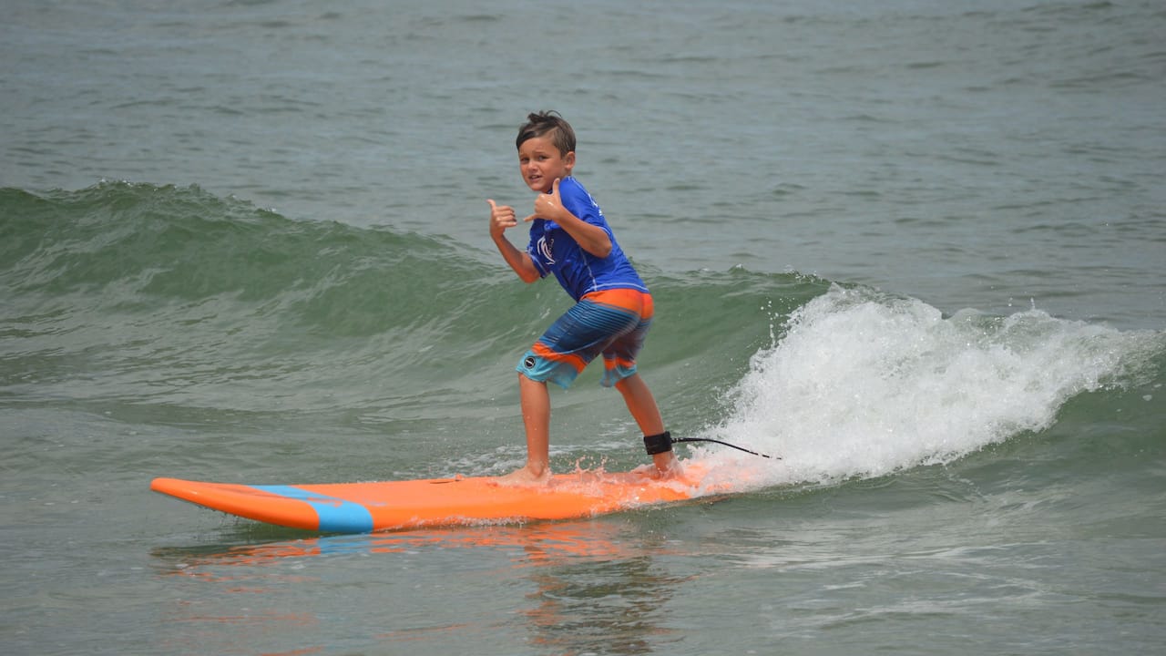 Kid Surfing