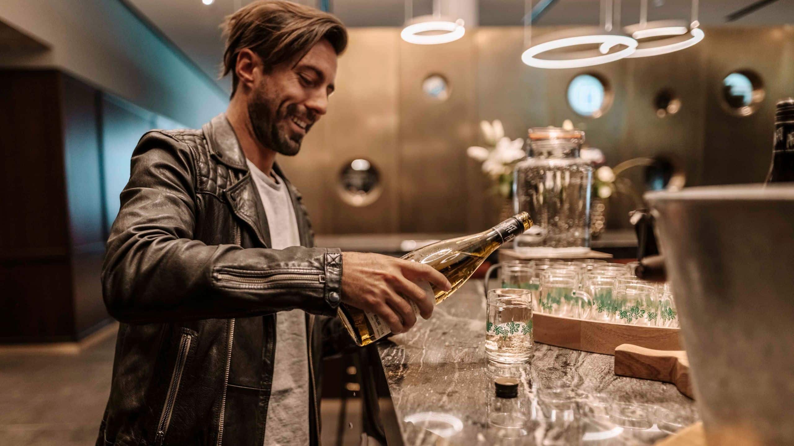 Andaz Vienna Am Belvedere Man Enjoying Wine Hour