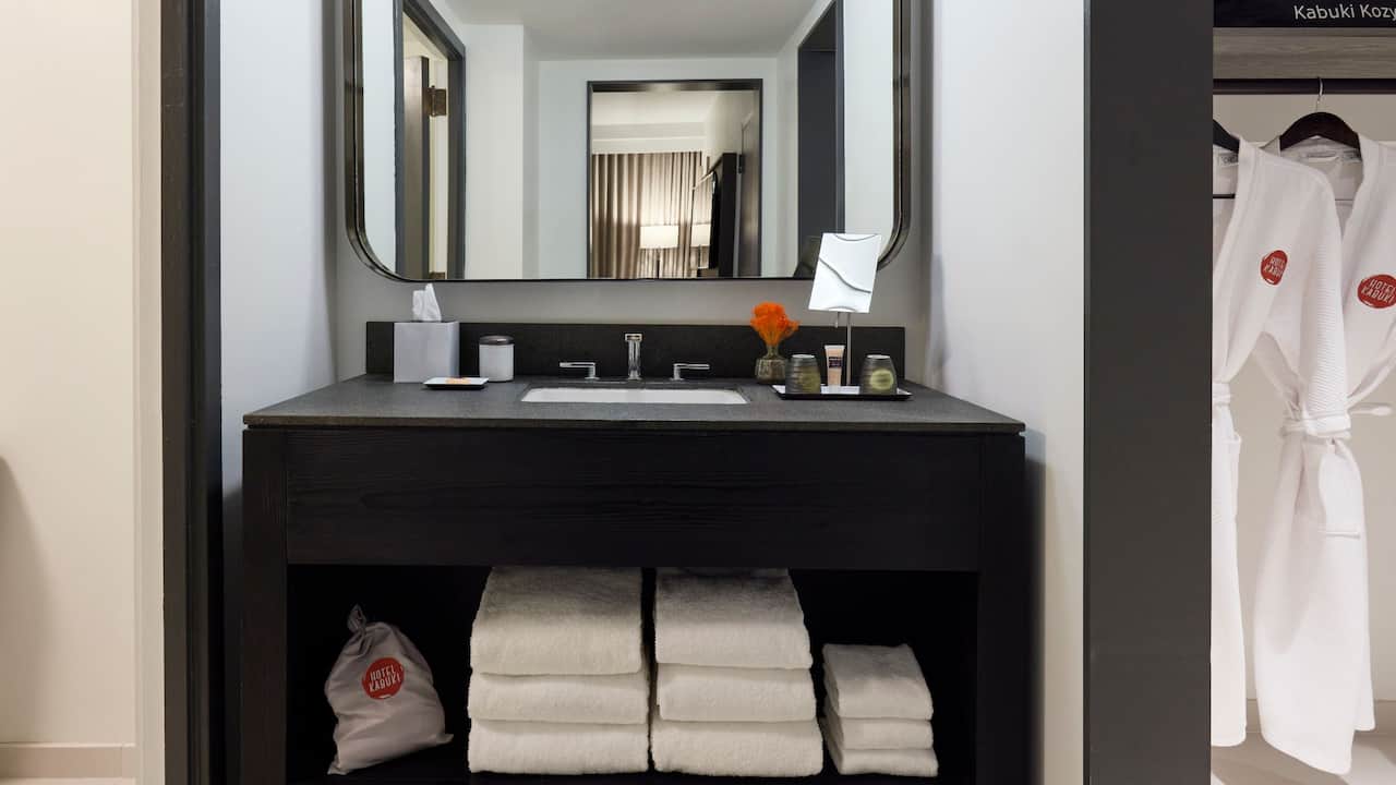 King Suite bathroom with spacious vanity and bathrobes