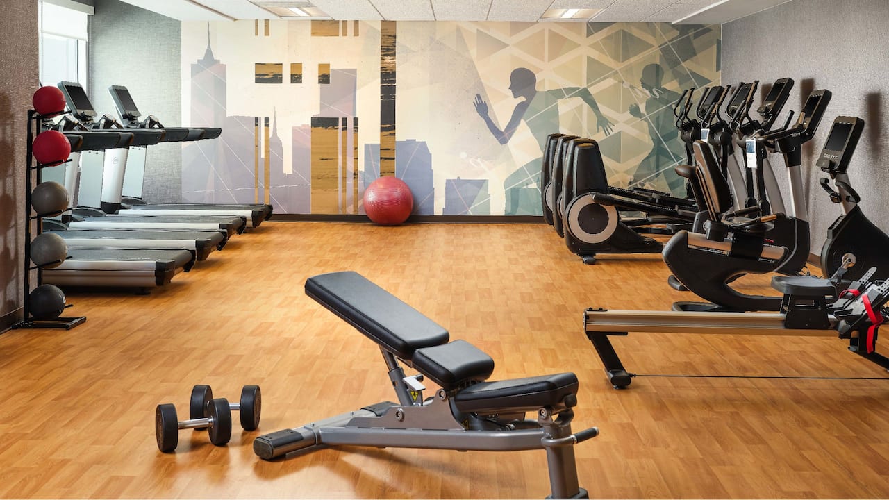 Fitness center with cardio equipment and free weights 