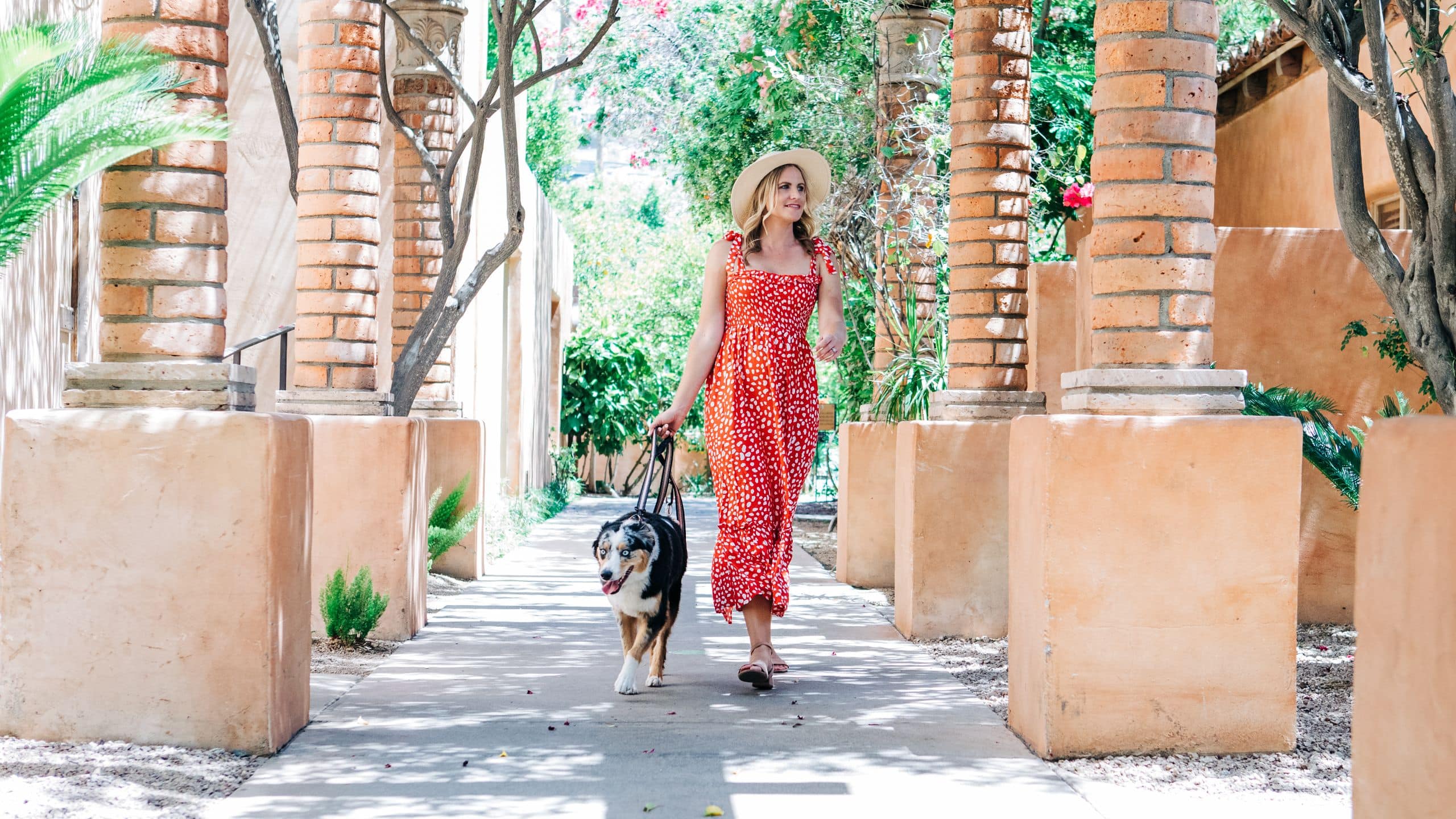 Royal Palms Resort and Spa Guest Walking Dog Outside