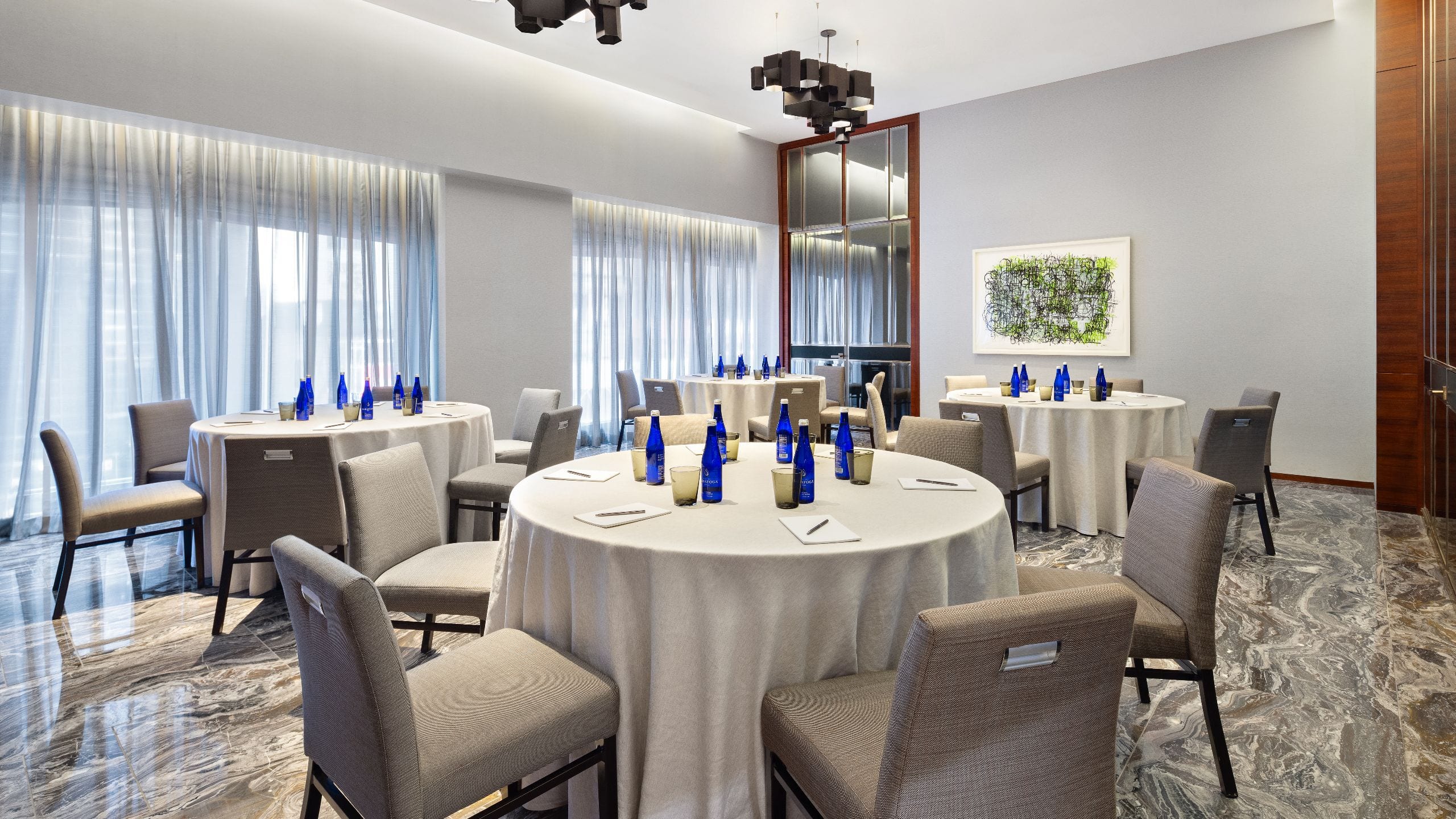 2 of 4 Round tables in hotel dining room