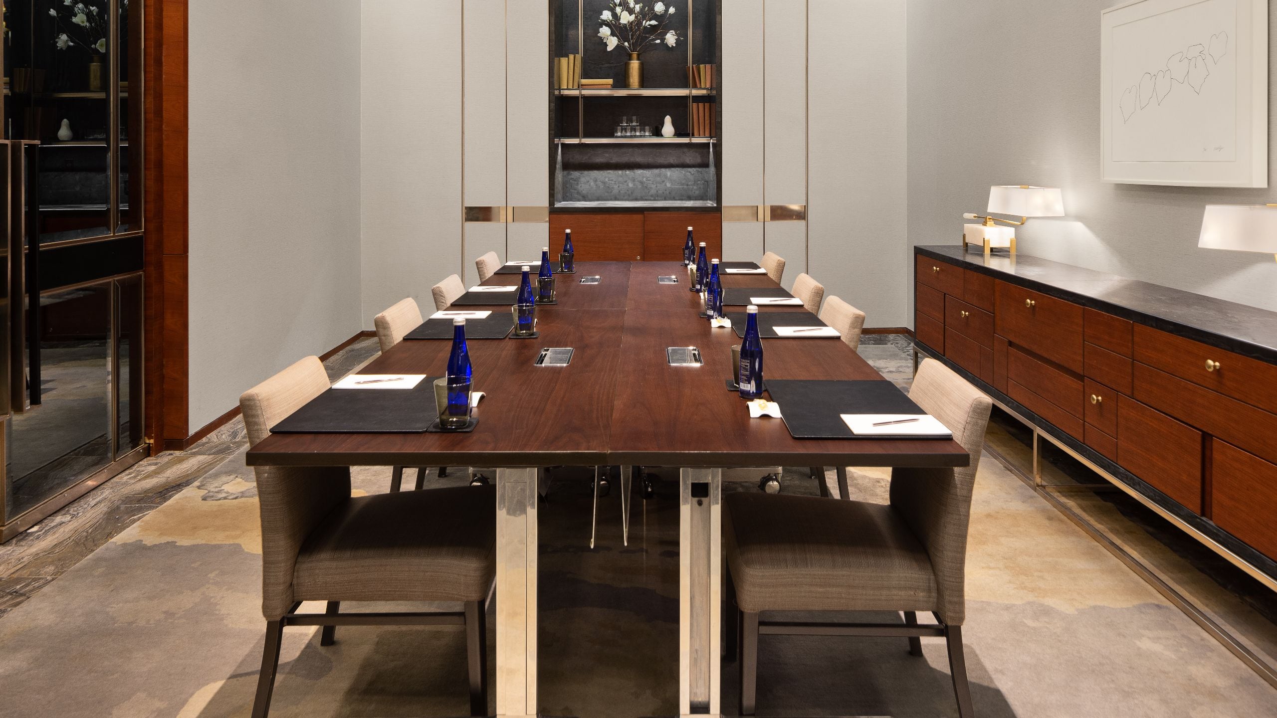 4 of 4 Meeting room with chairs and large windows overlooking a city skyline