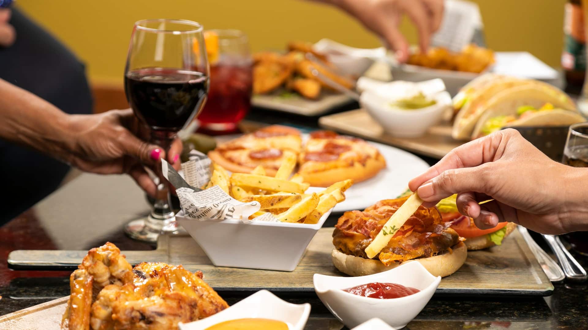 Hyatt Place Bayamón Dining Table Fries Pizza Chicken Wings Wine