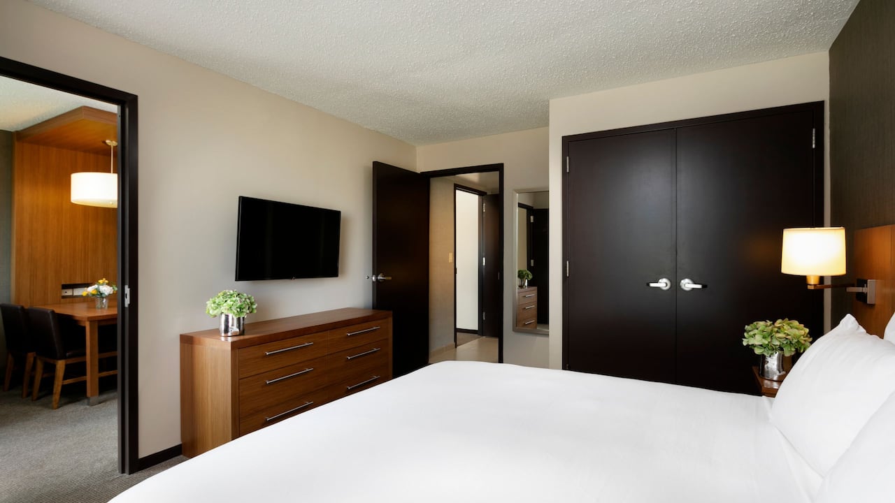 King Bed One Bedroom Suite with wall-mounted television 