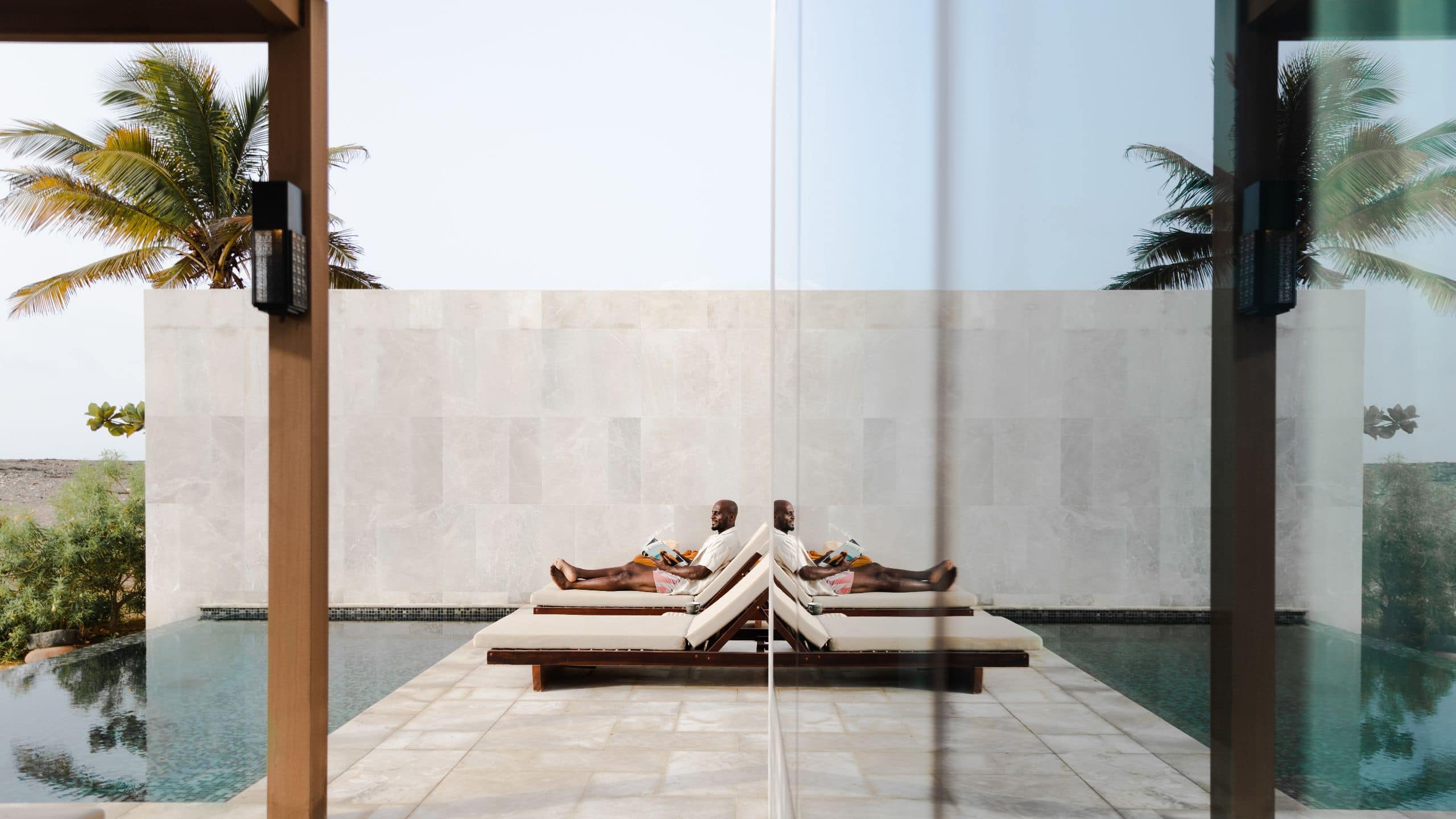 Alila Hinu Bay Man Lounging By Pool