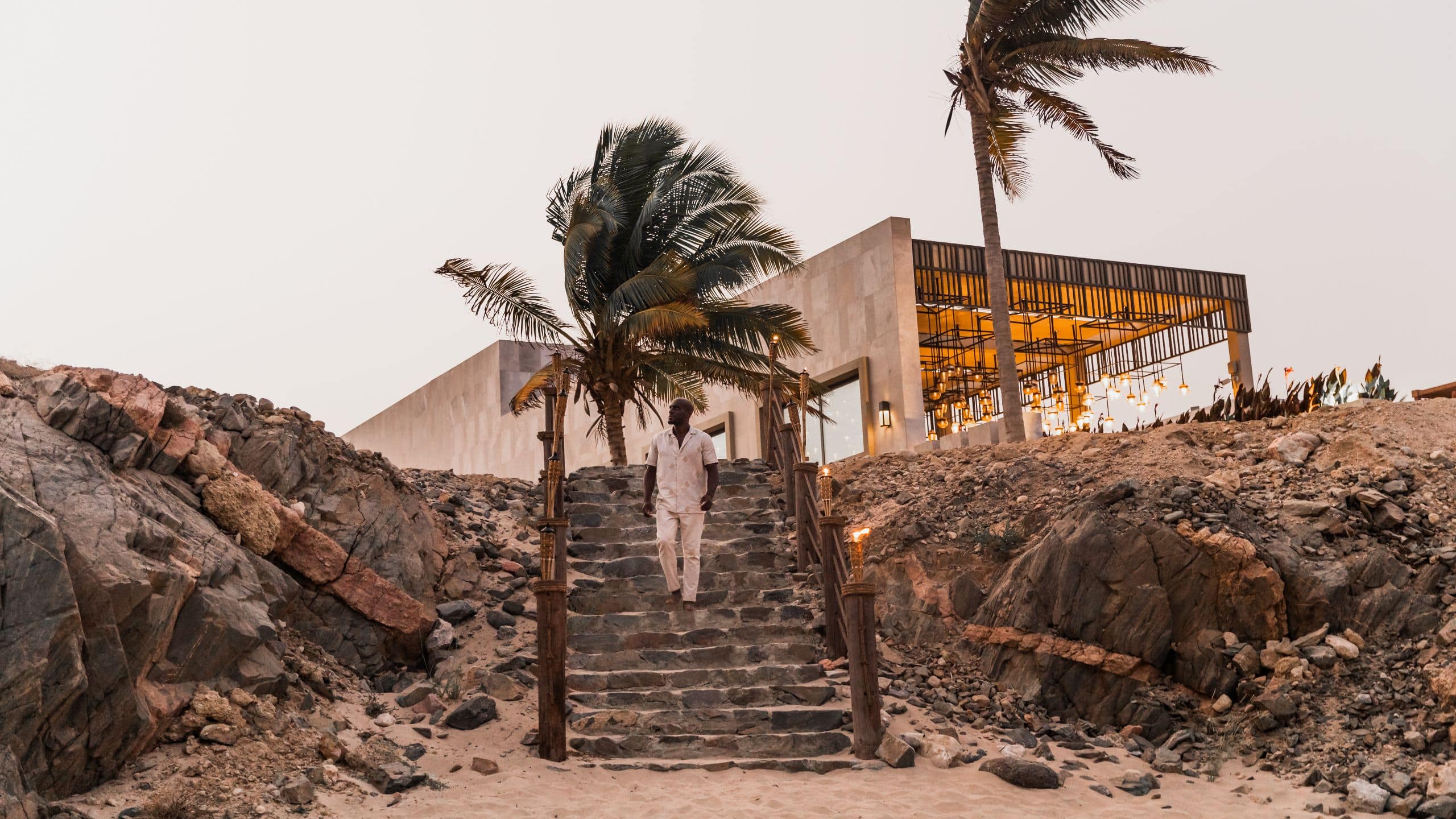 2 of 3 Alila Hinu Bay Man Walking Down Stairs