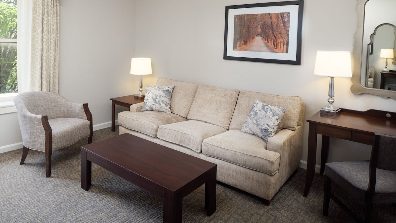 Parlor Suite living room with sofa, chair, and desk