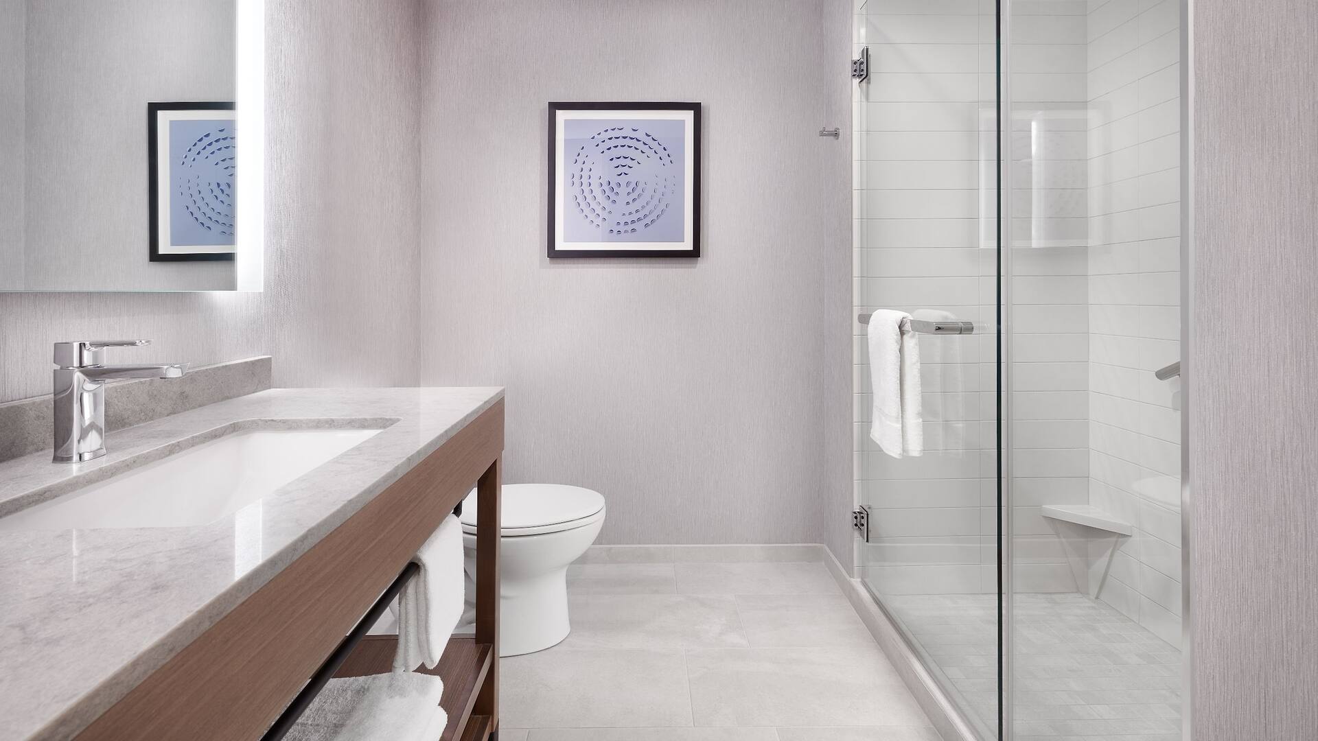 Guestroom Bathroom Shower Sink Towels View