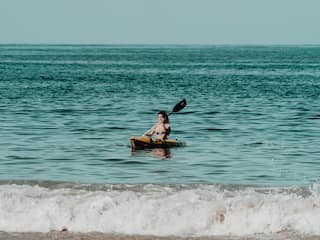 Thompson Zihuatanejo, a Beach Resort Woman Kayak Paddleboading
