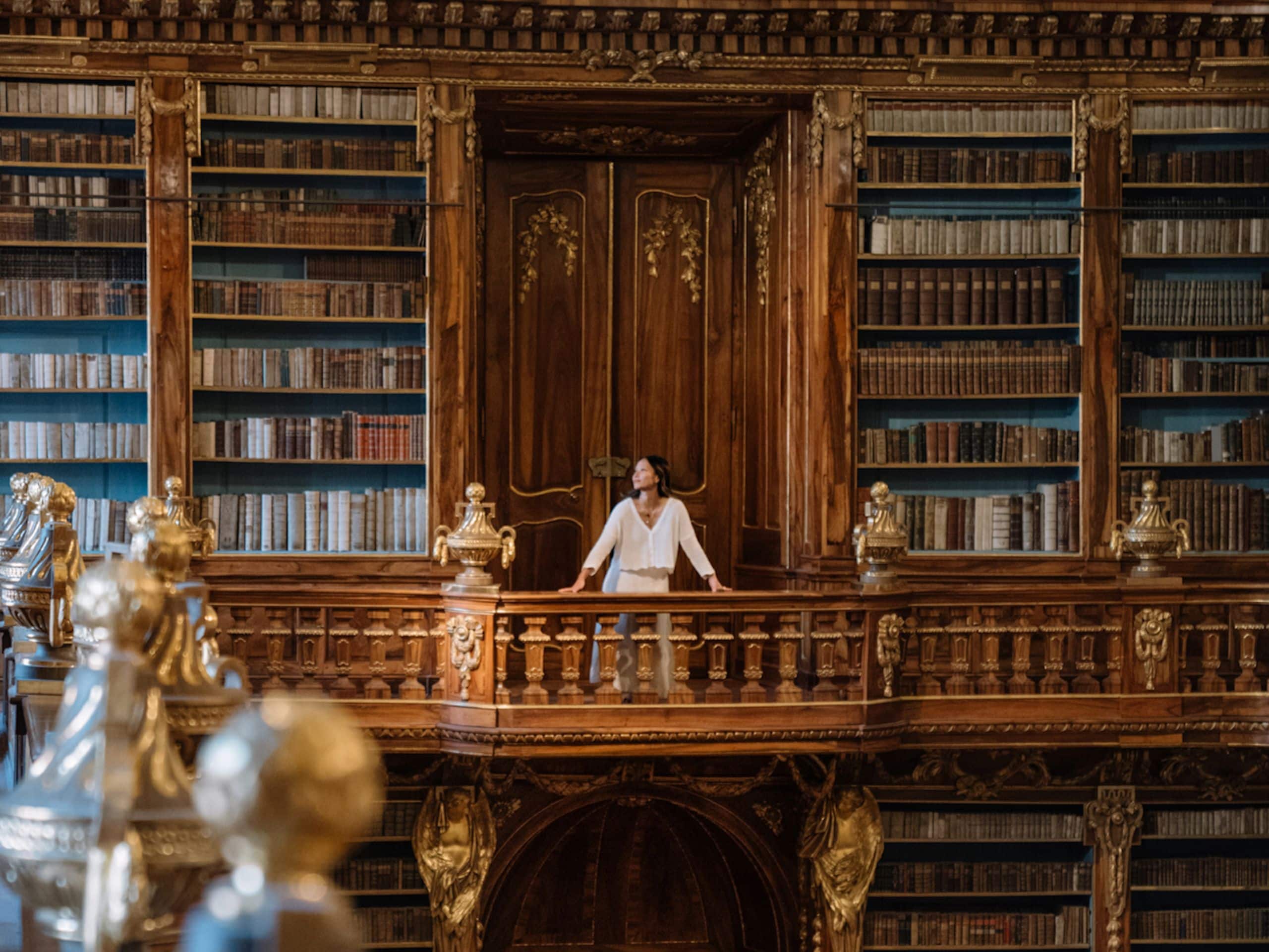 Woman discovers Strahov Library in Prague during her incentive trip at Andaz Prague.