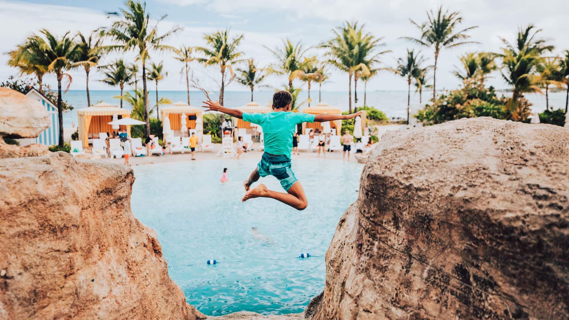 Grand Hyatt Baha Mar Blue Deans Hole Pool Cliff Jump Boy
