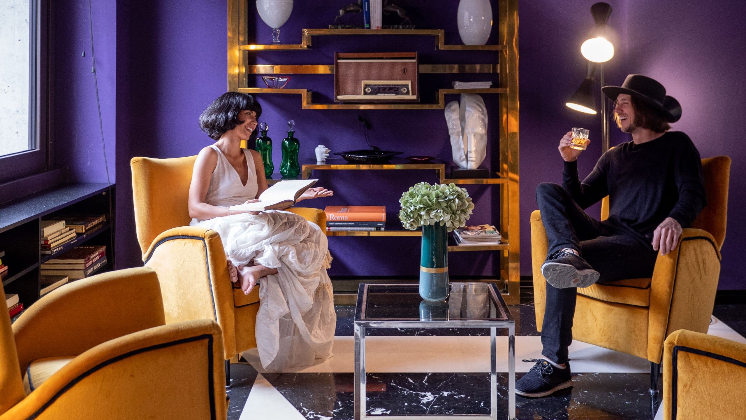 Couple enjoying boutique hotel lobby in RomeCouple hugging near the Colosseum