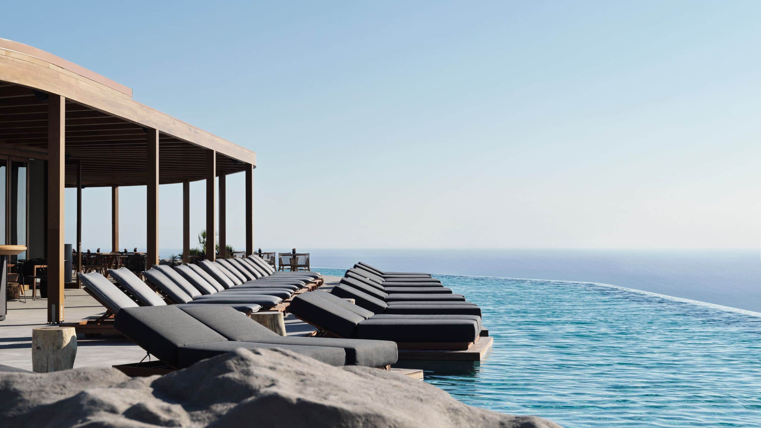Magma Resort Santorini Magma Pool Sunbeds Rock