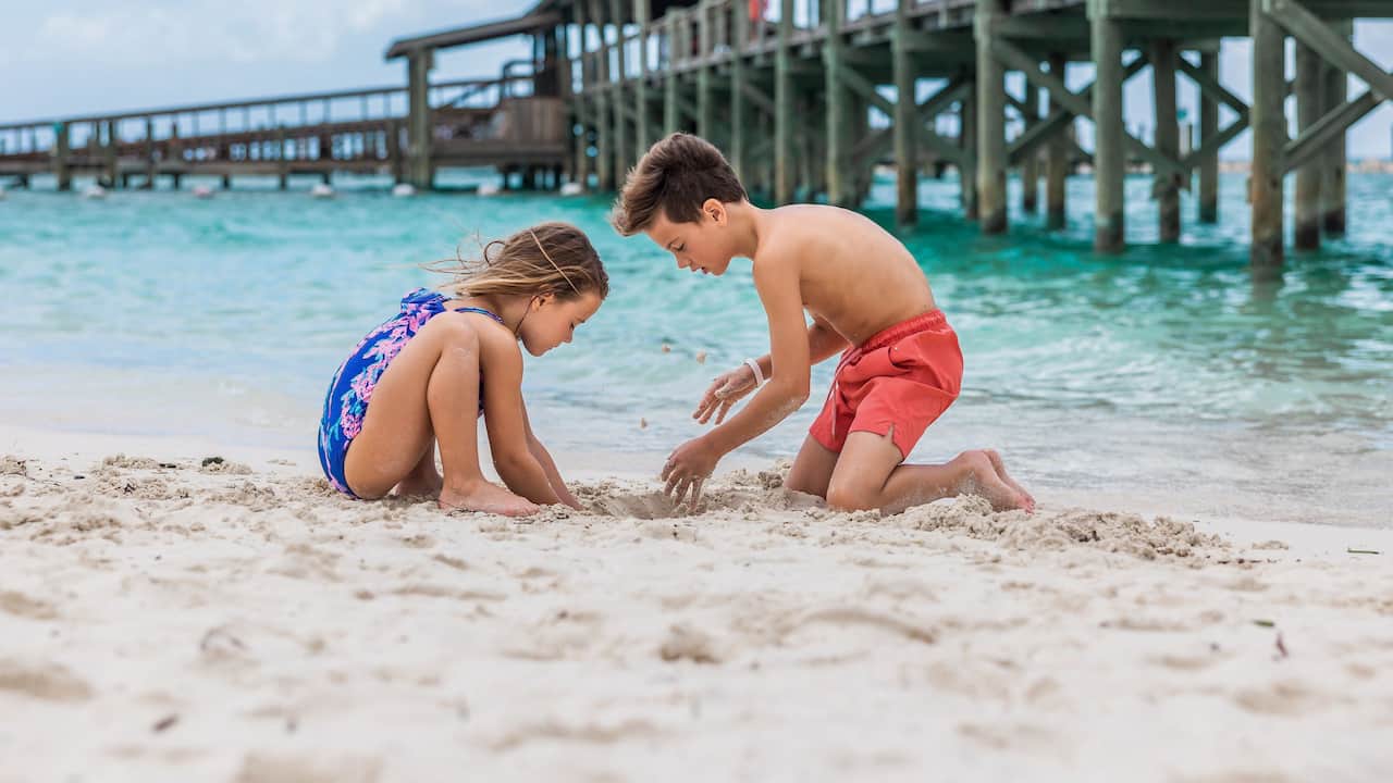 Kids Playing In The Sand