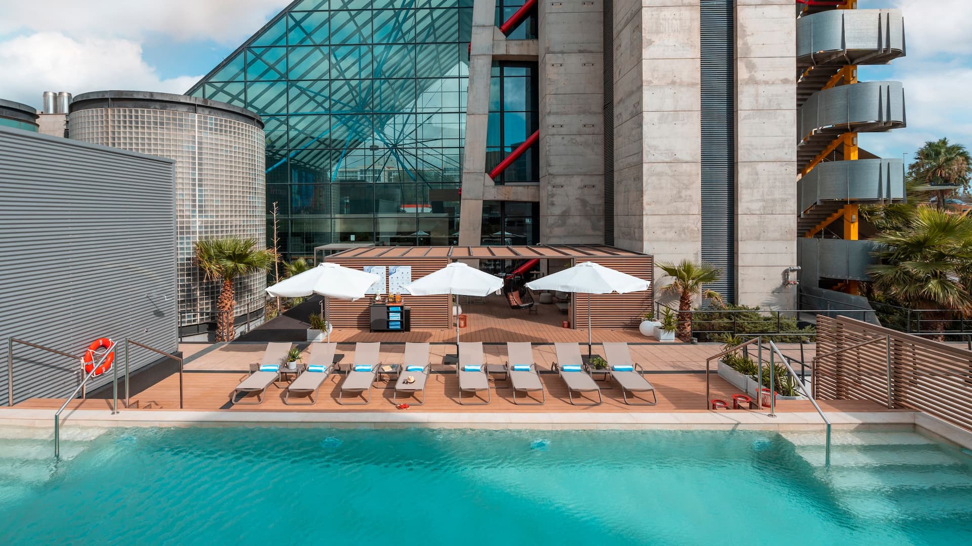 Hyatt Regency Barcelona Tower Sunset Pool Deck Chairs