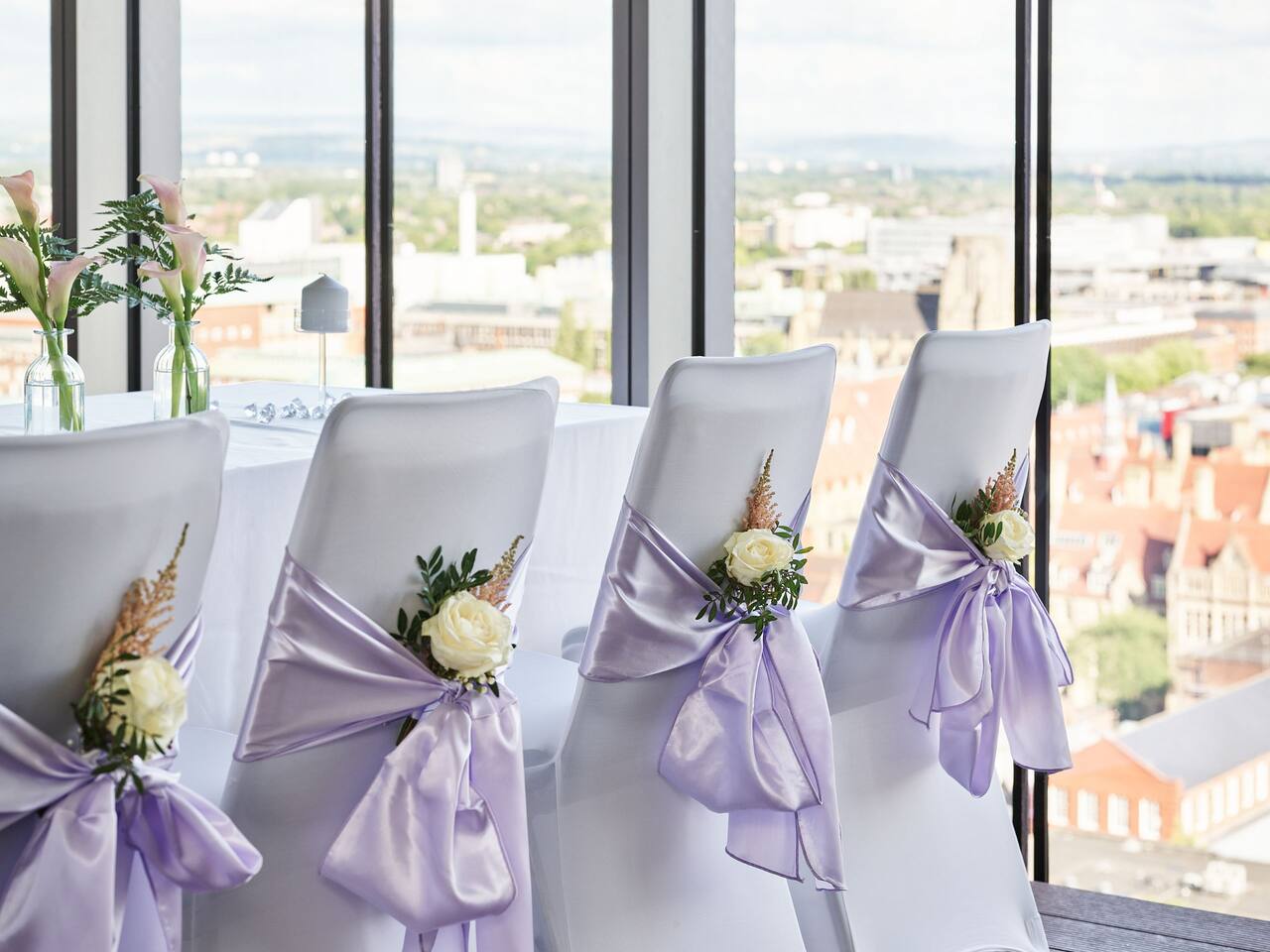 Wedding chairs lined up with view out of window