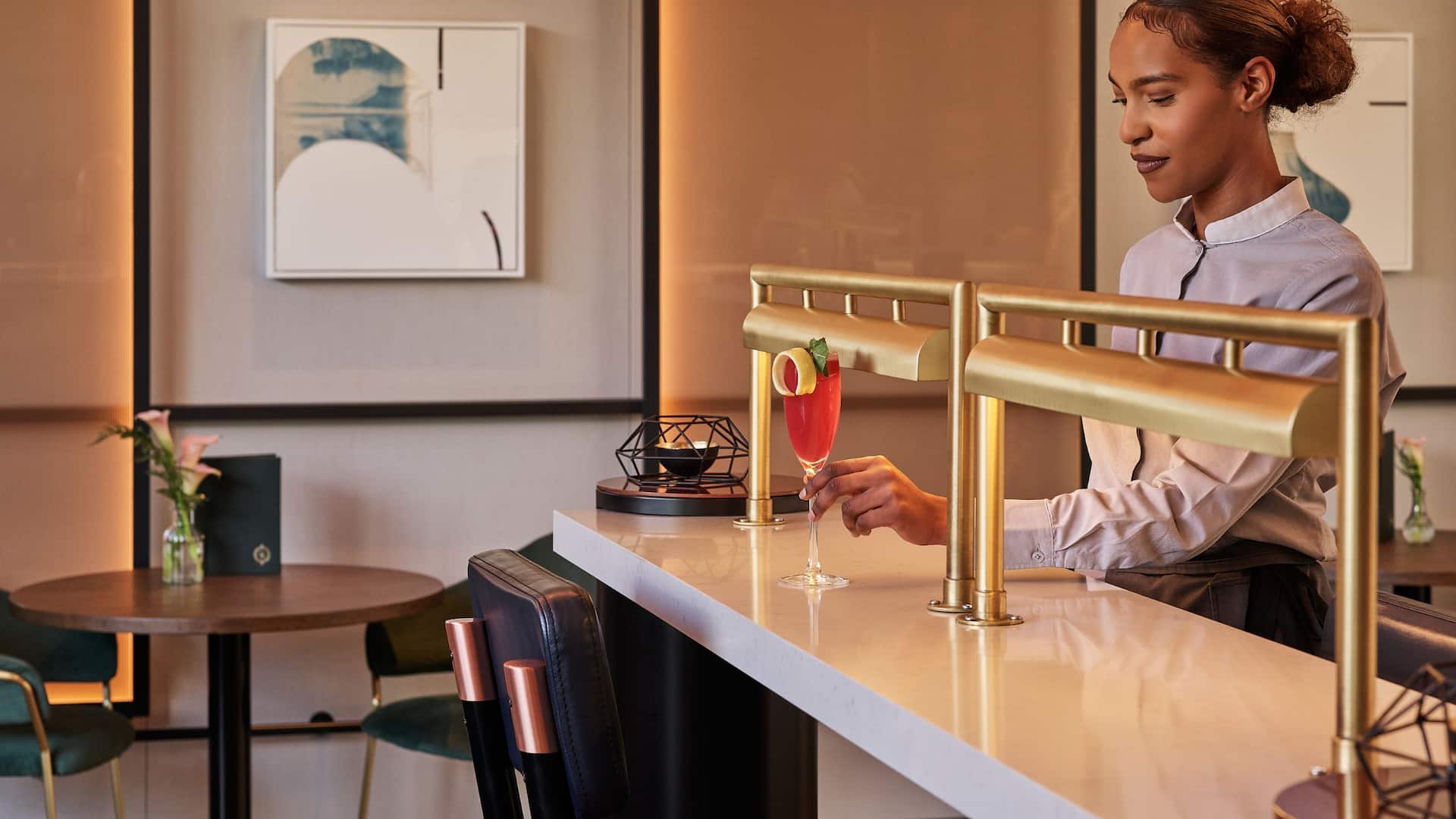 Hyatt Regency Manchester Graduate Bar Tender Placing Drinks