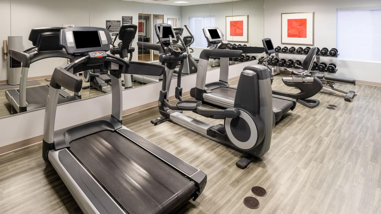 24-Hour fitness center with cardio equipment and free weights