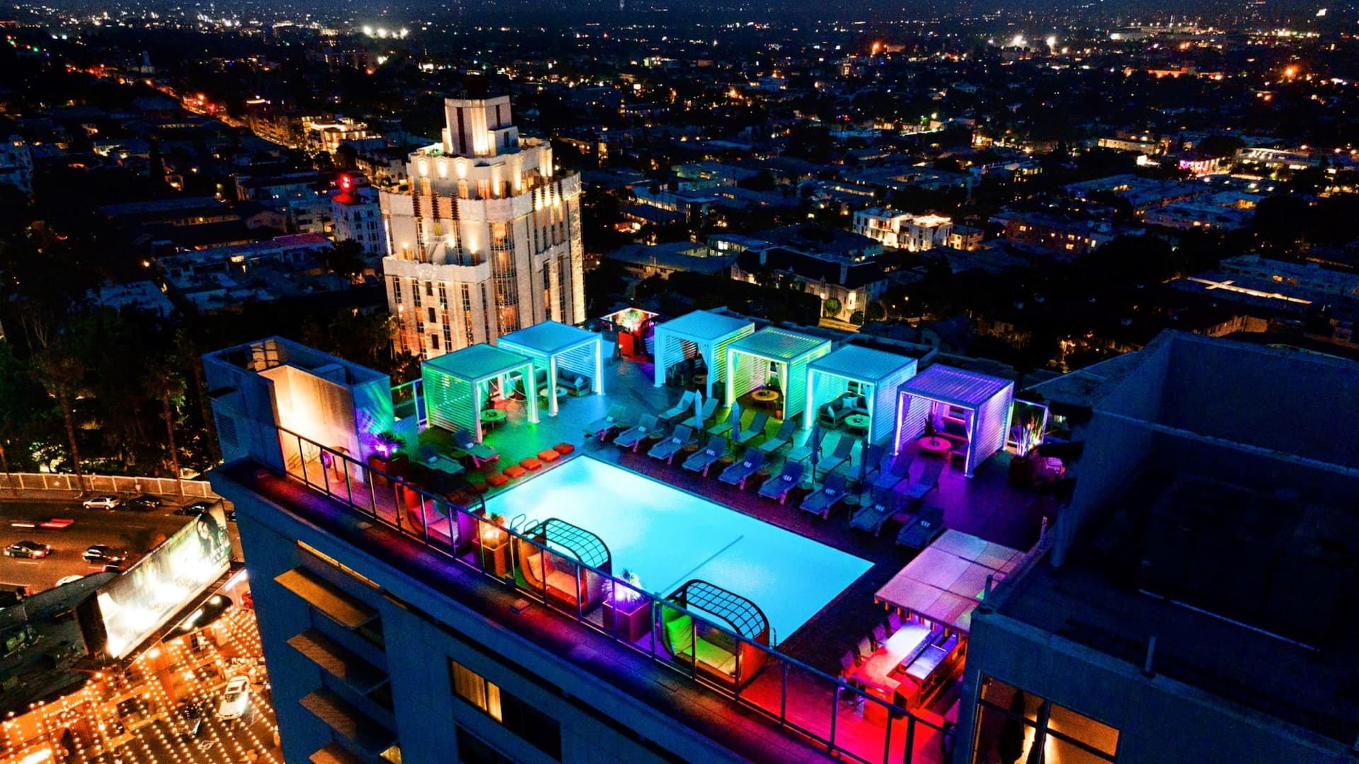 Rooftop Pool Night Lights Cityscape