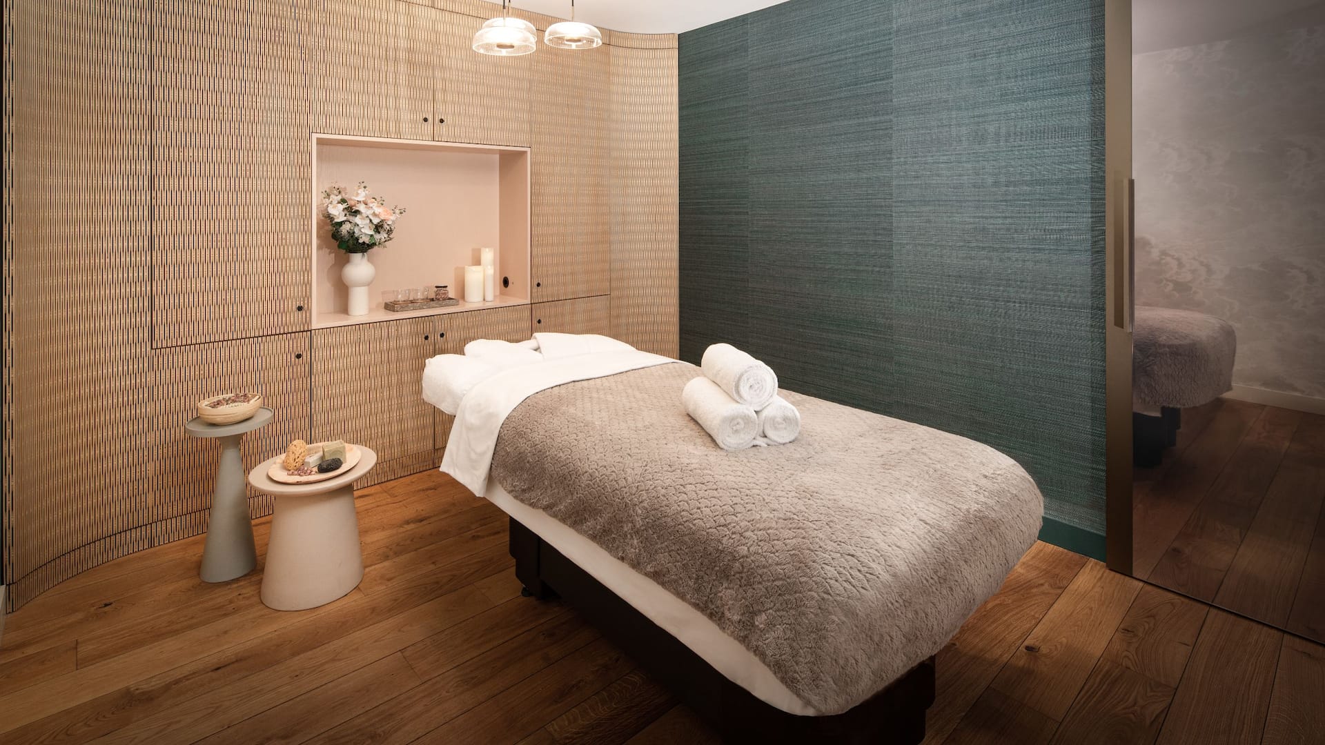 An ergonomic massage bed which is set up in a tranquil room with soft lighting at the wellness at Hyatt Regeny Amsterdam.