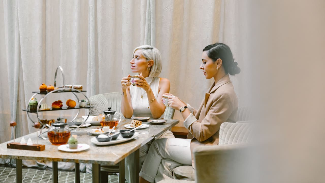 Experience the epitome of sophistication with our classic Afternoon Tea at the elegant Lobby Lounge of Park Hyatt Zurich. Indulge in a selection of pastries and other delightful delicacies while basking in luxury.