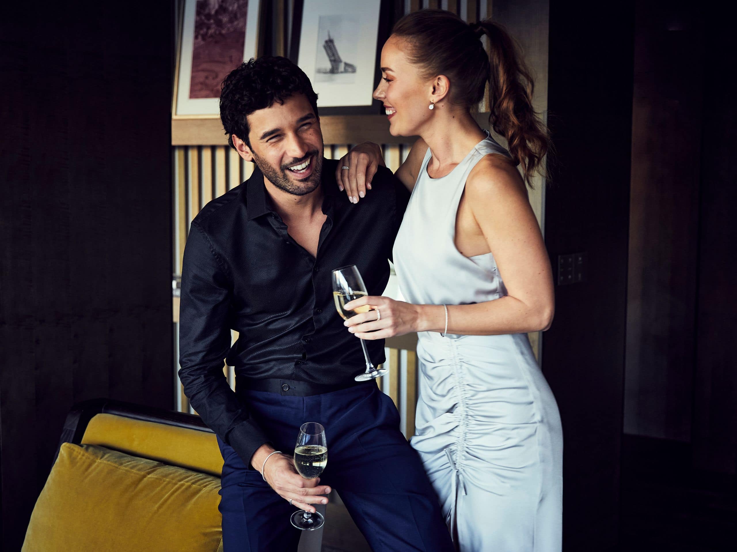 https://assets.hyatt.com/content/dam/hyatt/hyattdam/images/2022/08/30/1147/GLOBAL-P0844-Suite-Couple-Smiling-Wine.jpg/GLOBAL-P0844-Suite-Couple-Smiling-Wine.4x3.jpg