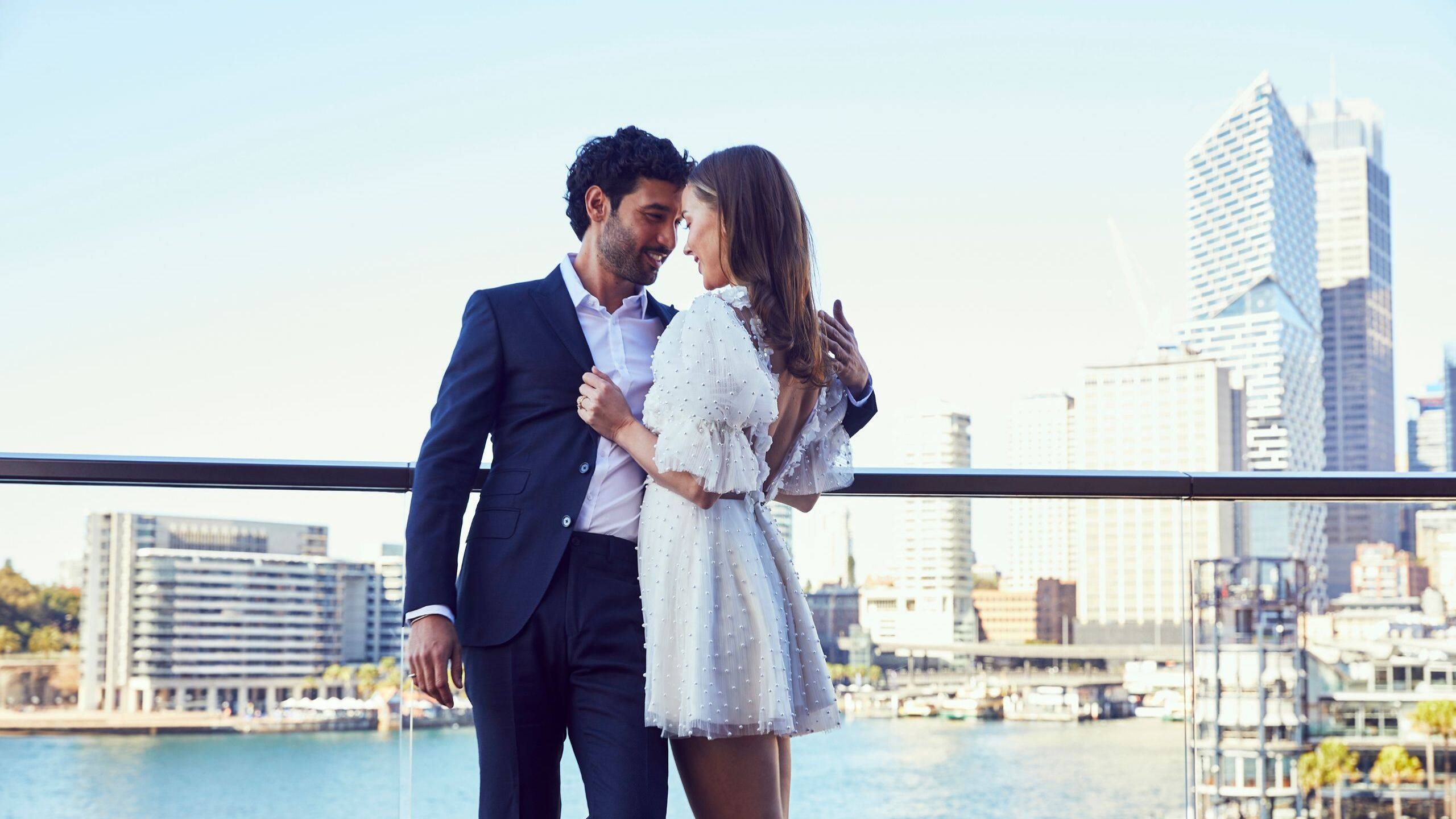 1 of 3 Global Wedding Balcony Bride Groom