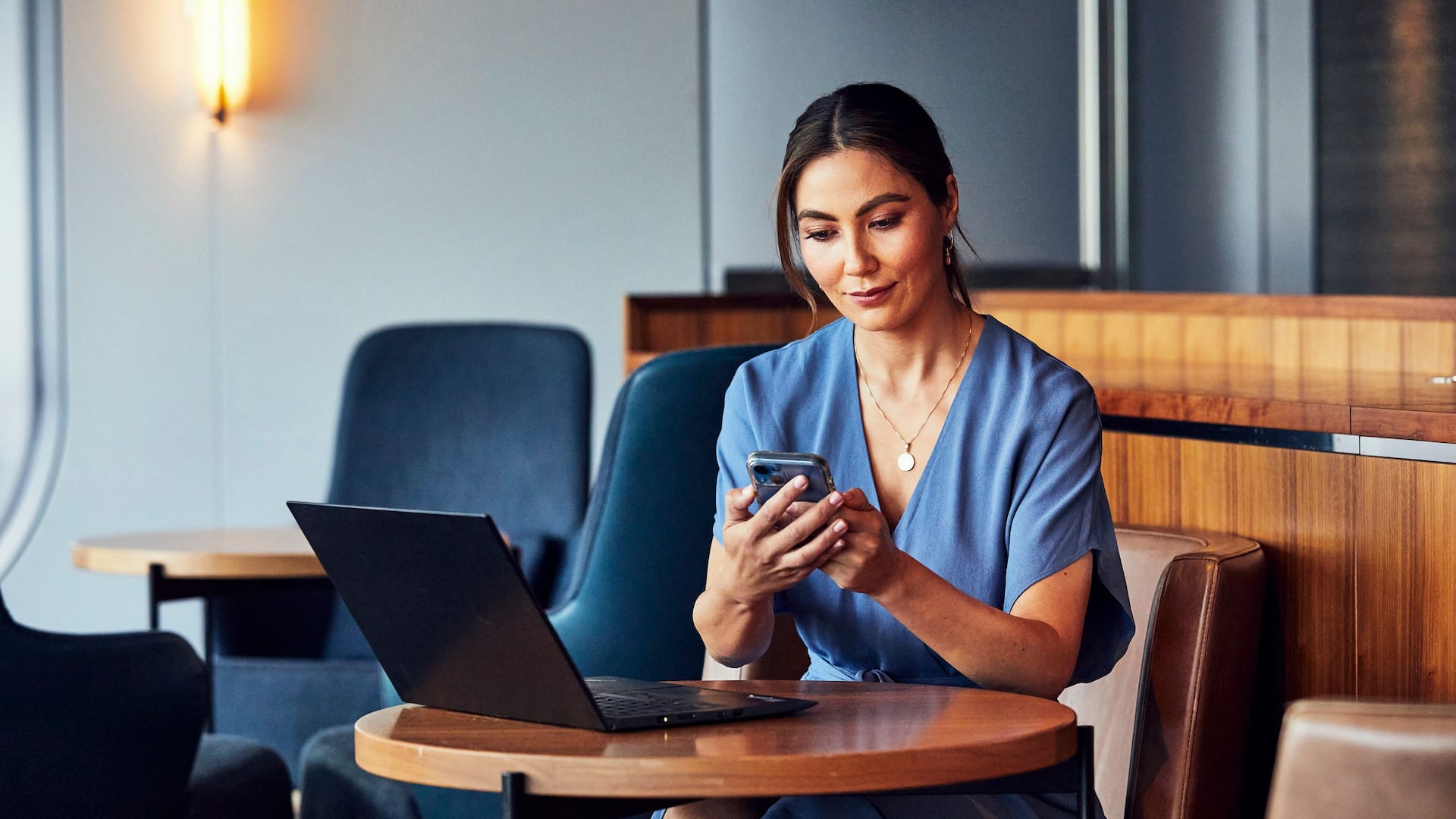 Global Woman Sitting Computer Cellphone