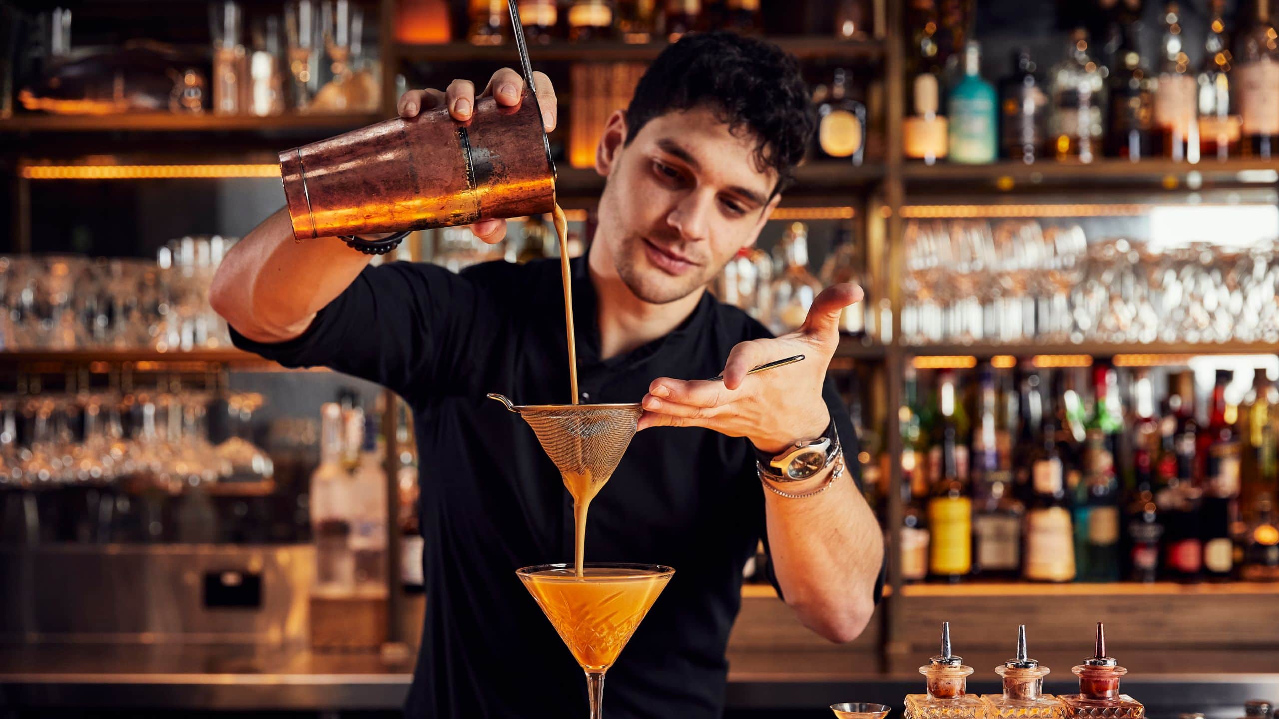 Global Bartender Pouring Cocktail