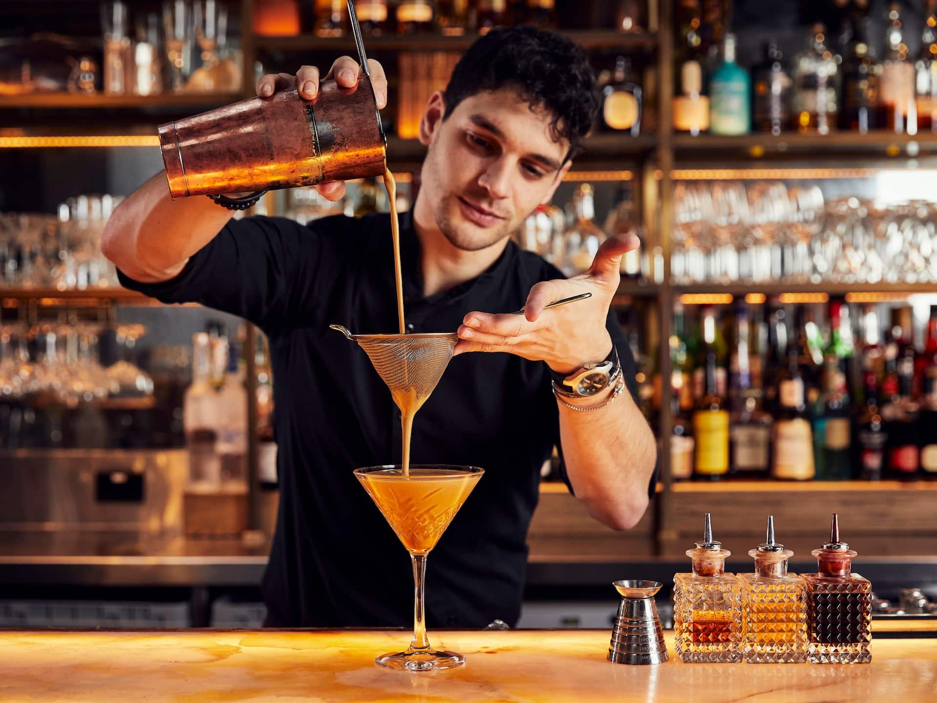 Global Bartender Pouring Cocktail
